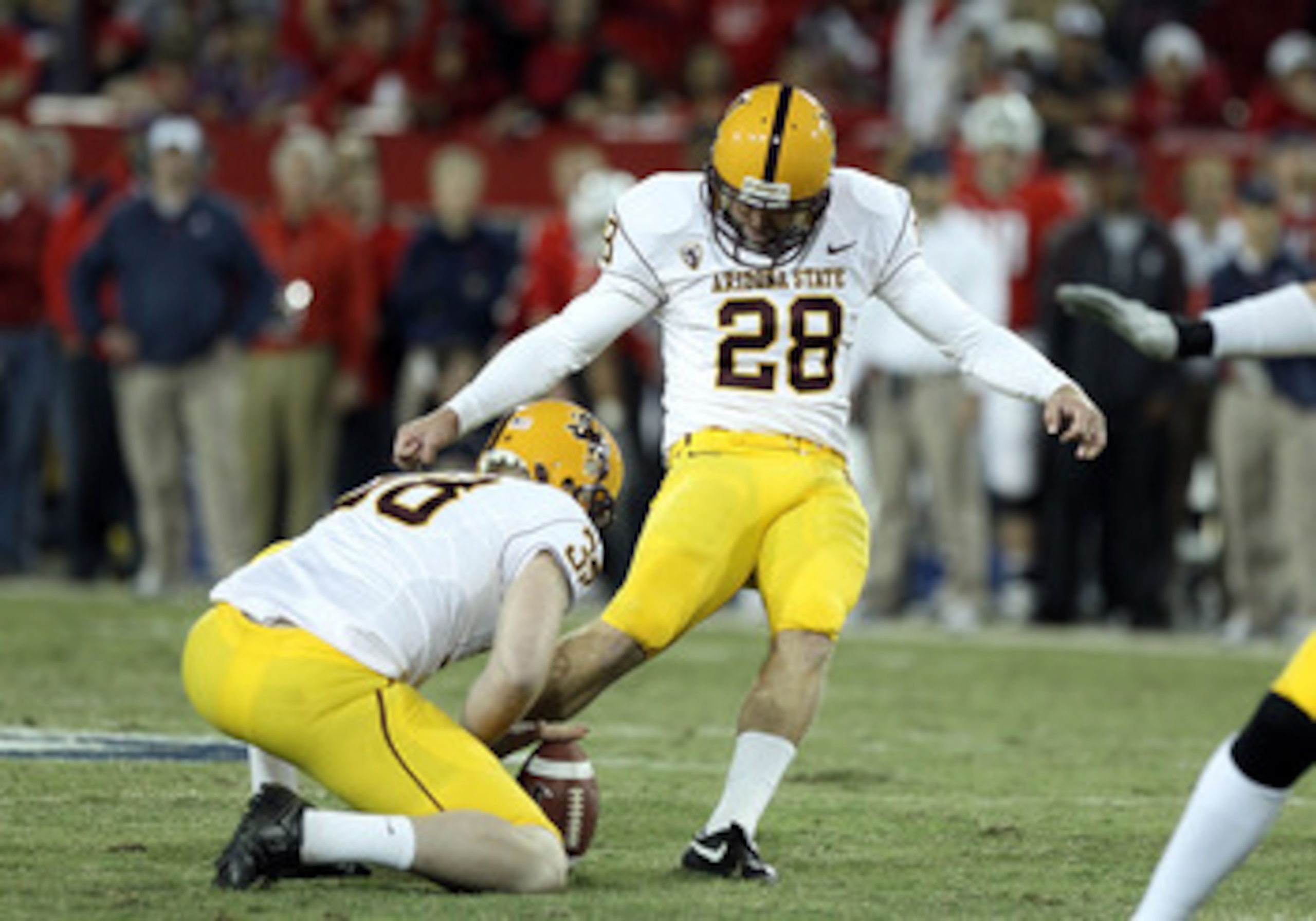 TUCSON, AZ - DECEMBER 02:  Kicker Thomas Weber #28 of the Arizona State Sun Devils kicks a field goal during the college football game at Arizona Stadium on December 2, 2010 in Tucson, Arizona. The Sun Devils defeated the Wildcats 30-29 in double overtime