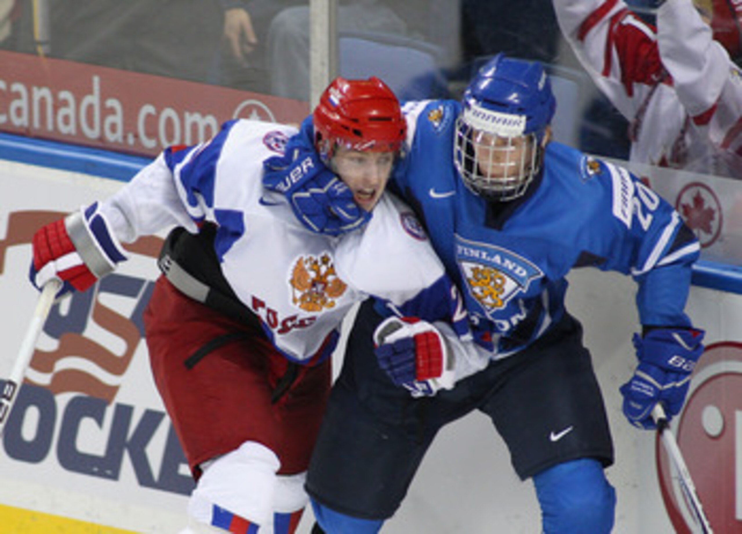 BUFFALO, NY - JANUARY 02: Joel Armia #20 of Finland grabs Sergei Kalinin #21 of Russia during the 2011 IIHF World U20 Championship game between Finland and Russia on January 2, 2011 in Buffalo, New York.Russia won 4-3 in overtime.(Photo by Rick Stewart/Ge