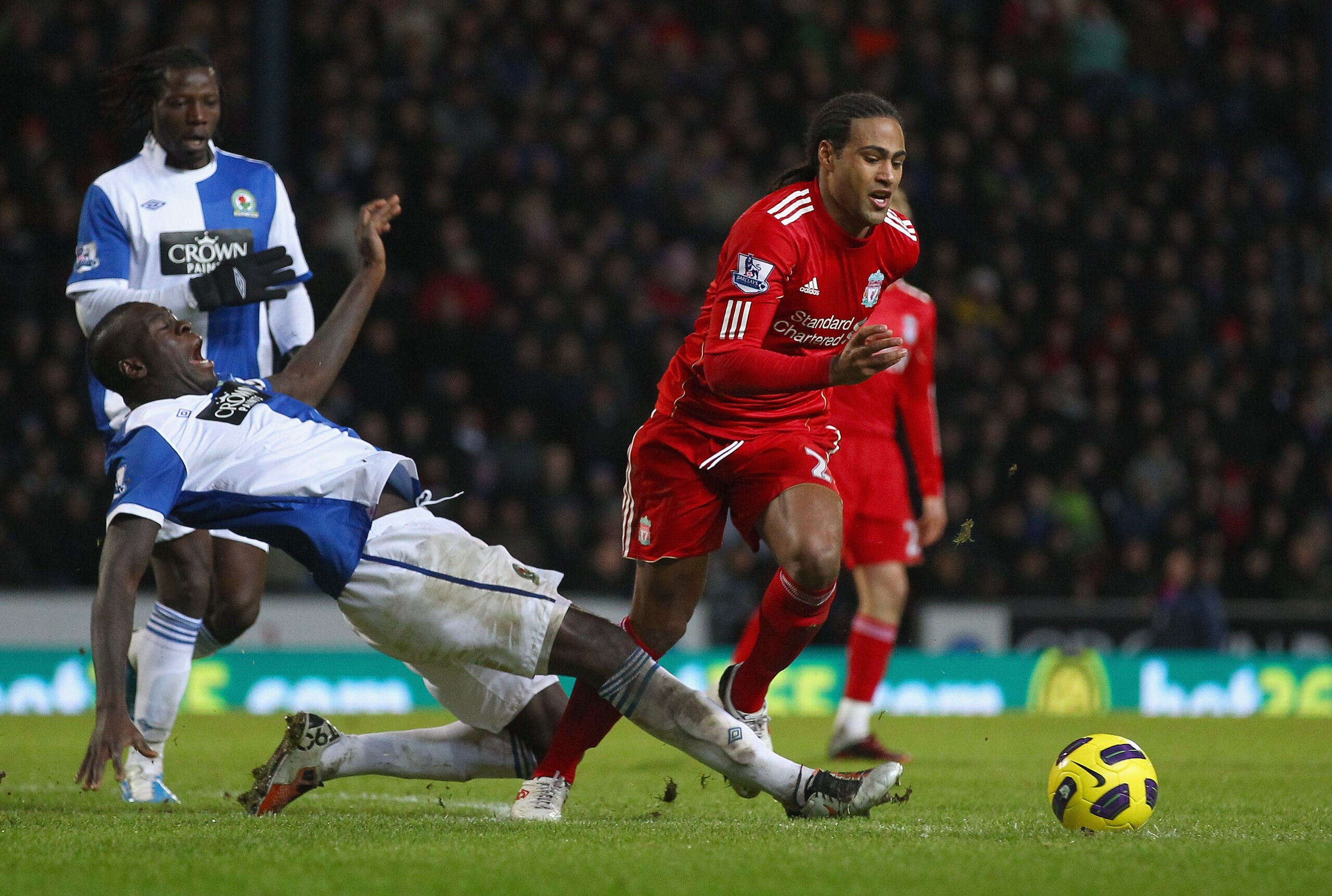 BLACKBURN, ENGLAND - JANUARY 05:  Glen Johnson of Liverpool moves away from Chris Samba of Blackburn Rovers during the Barclays Premier League match between Blackburn Rovers and Liverpool at Ewood park on January 5, 2011 in Blackburn, England.  (Photo by
