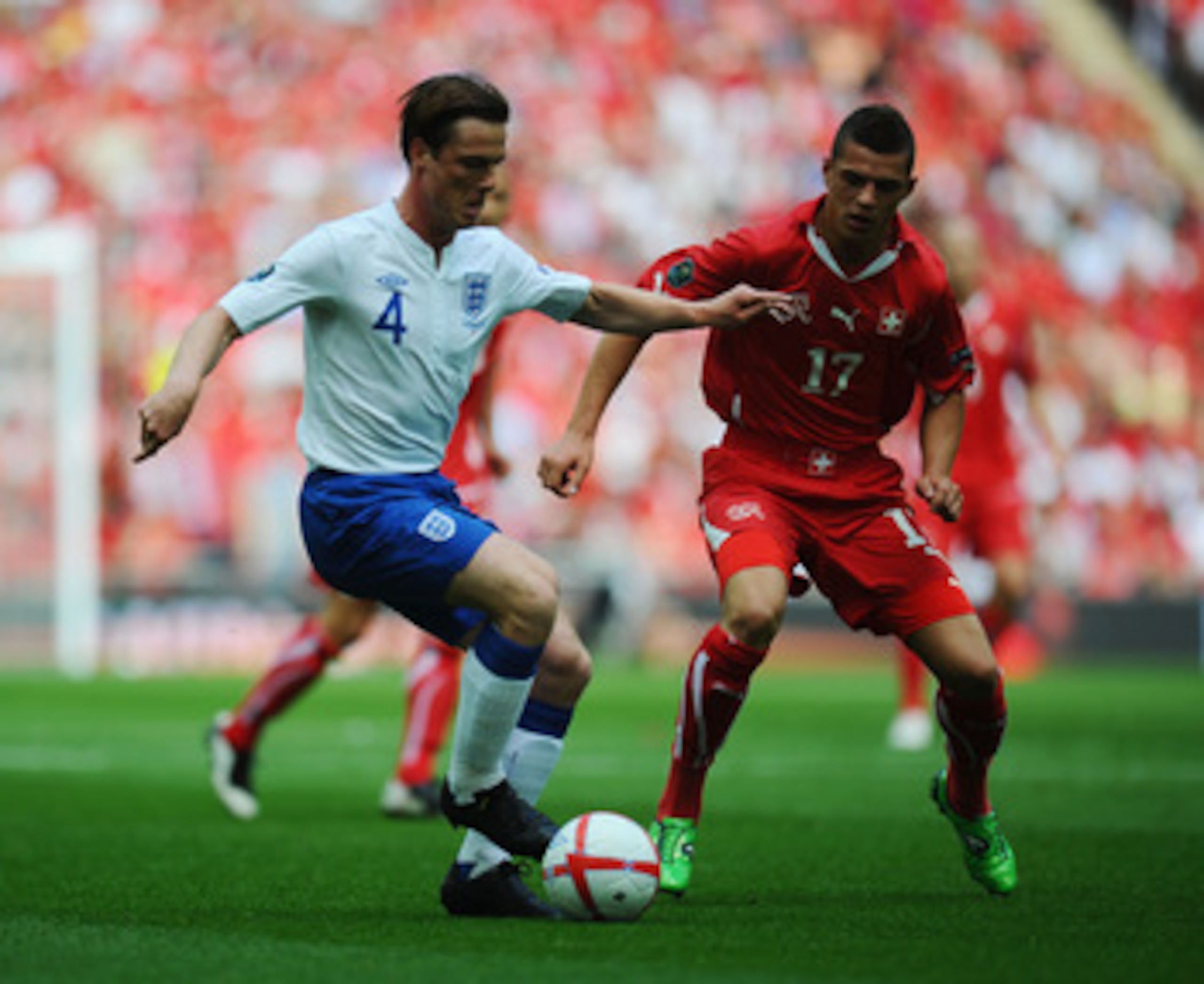 LONDON, ENGLAND - JUNE 04: Scott Parker of England (L) in action against Granit Xhaka of Switzerland during the UEFA EURO 2012 group G qualifying match between England and Switzerland at Wembley Stadium on June 4, 2011 in London, England.  (Photo by Clive