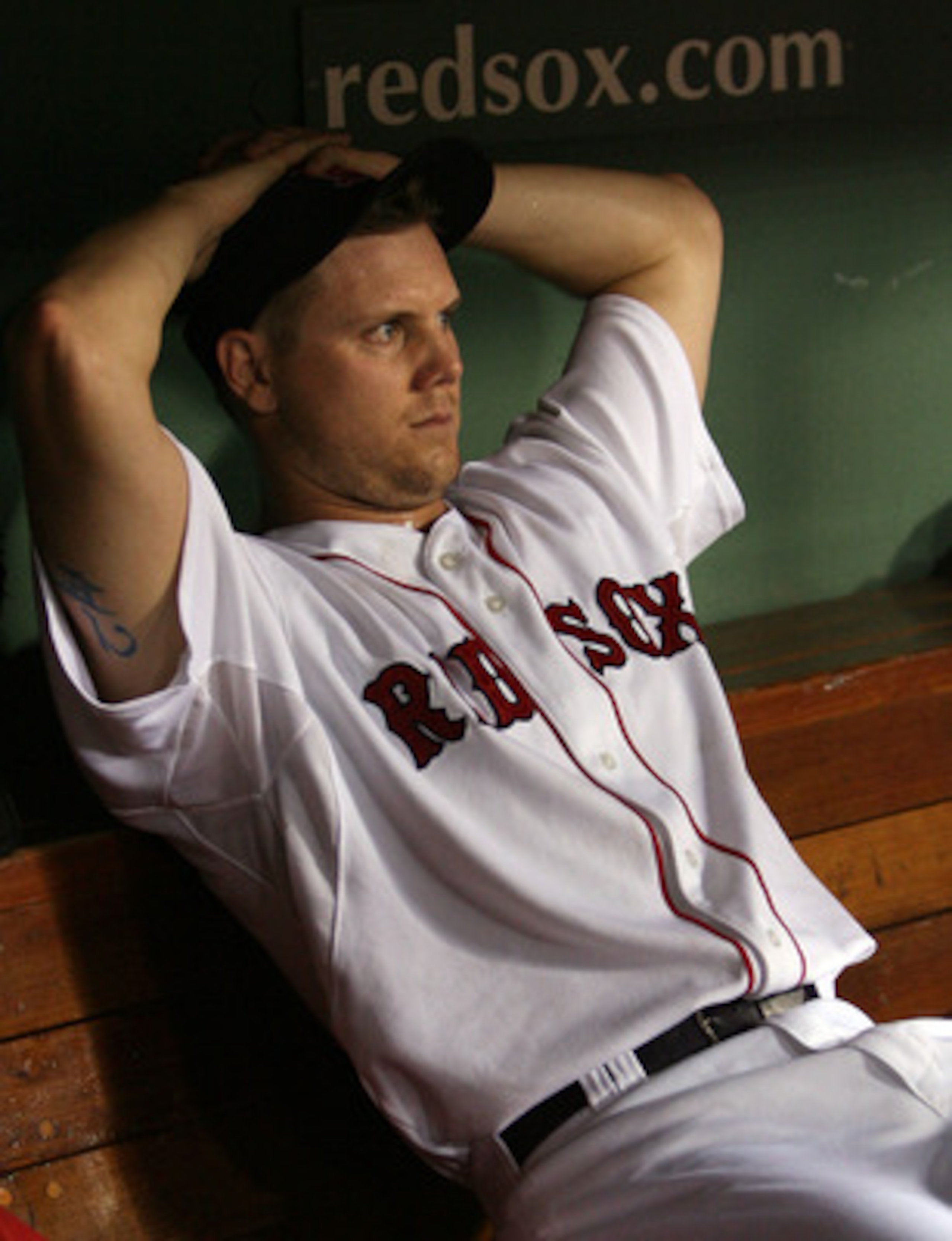 BOSTON - JULY 28:  Jonathan Papelbon #58 of the Boston Red Sox sits in the dugout after an error in the ninth inning against the Oakland Athletics at Fenway Park July 28, 2009 in Boston, Massachusetts.  (Photo by Elsa/Getty Images)