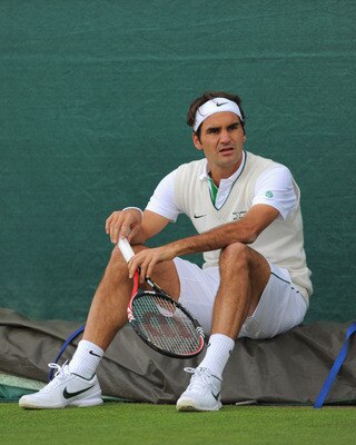 WIMBLEDON, ENGLAND - JUNE 19:  Roger Federer of Switzerland looks on during a training session ahead of the Wimbledon Lawn Tennis Championships on June 19, 2011 in Wimbledon, England.  (Photo by Michael Regan/Getty Images)