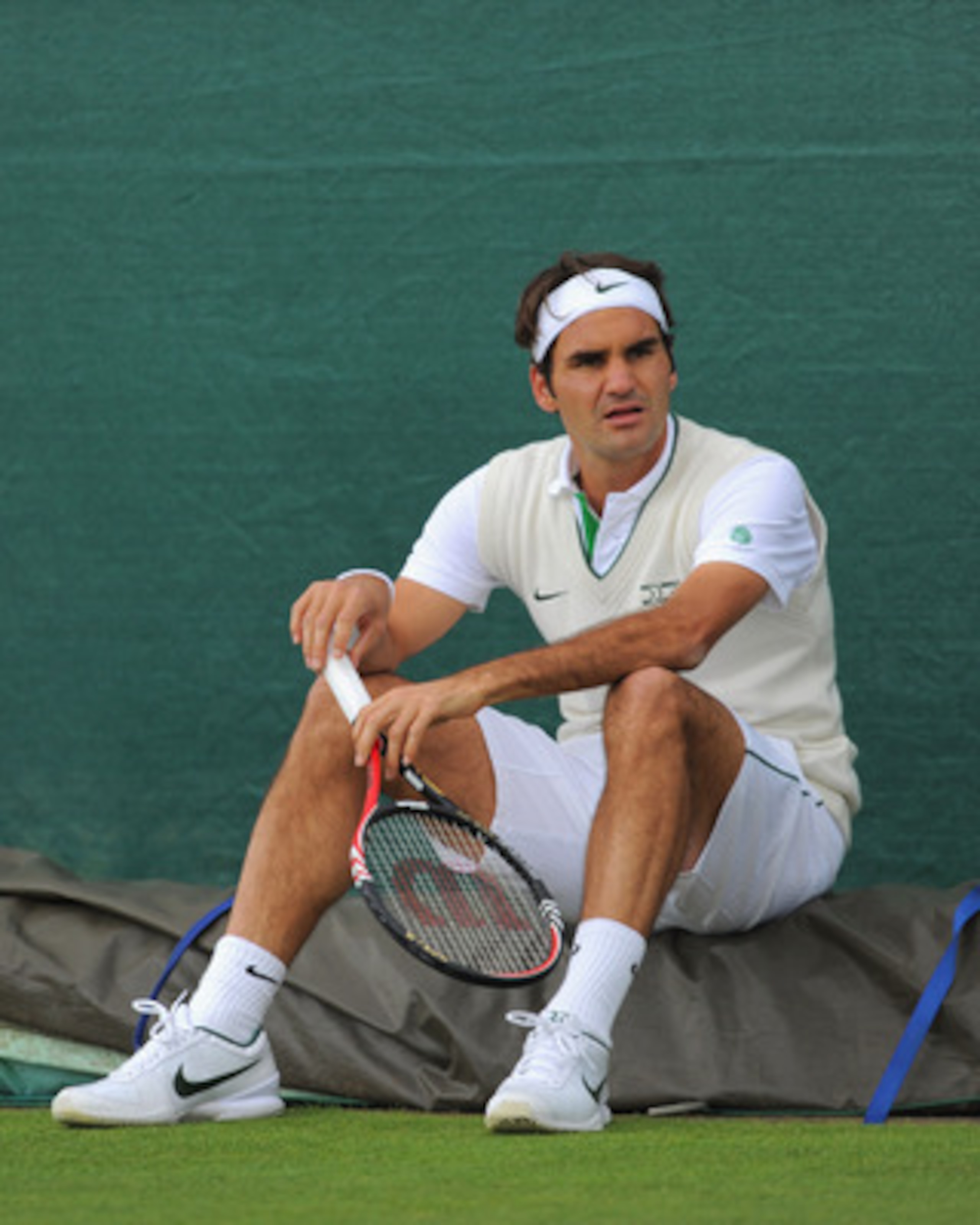 WIMBLEDON, ENGLAND - JUNE 19:  Roger Federer of Switzerland looks on during a training session ahead of the Wimbledon Lawn Tennis Championships on June 19, 2011 in Wimbledon, England.  (Photo by Michael Regan/Getty Images)