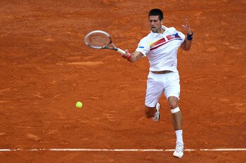PARIS, FRANCE - JUNE 03:  Novak Djokovic of Serbia hits a forehand during the men's singles semi final match between Roger Federer of Switzerland and Novak Djokovic of Serbia on day thirteen of the French Open at Roland Garros on June 3, 2011 in Paris, Fr