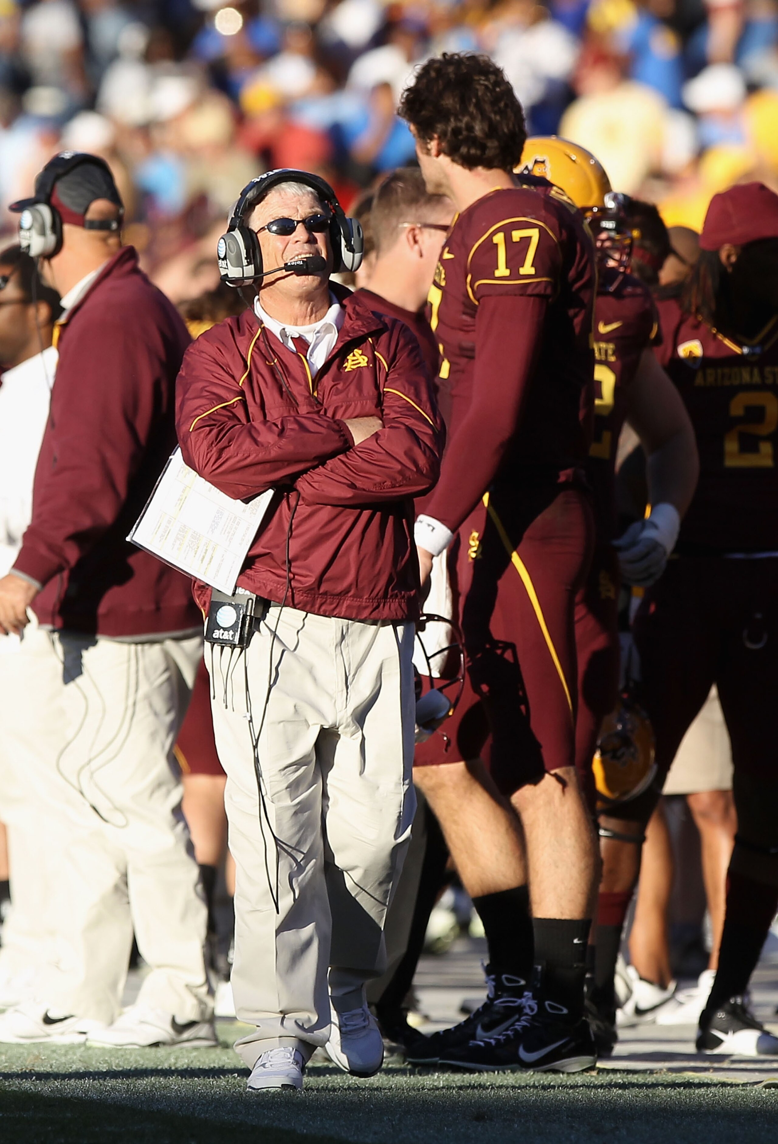 TEMPE, AZ - NOVEMBER 26:  Head coach Dennis Erickson of the Arizona State Sun Devils talks with quarterback Brock Osweiler #17 during the college football game against the UCLA Bruins at Sun Devil Stadium on November 26, 2010 in Tempe, Arizona.  (Photo by