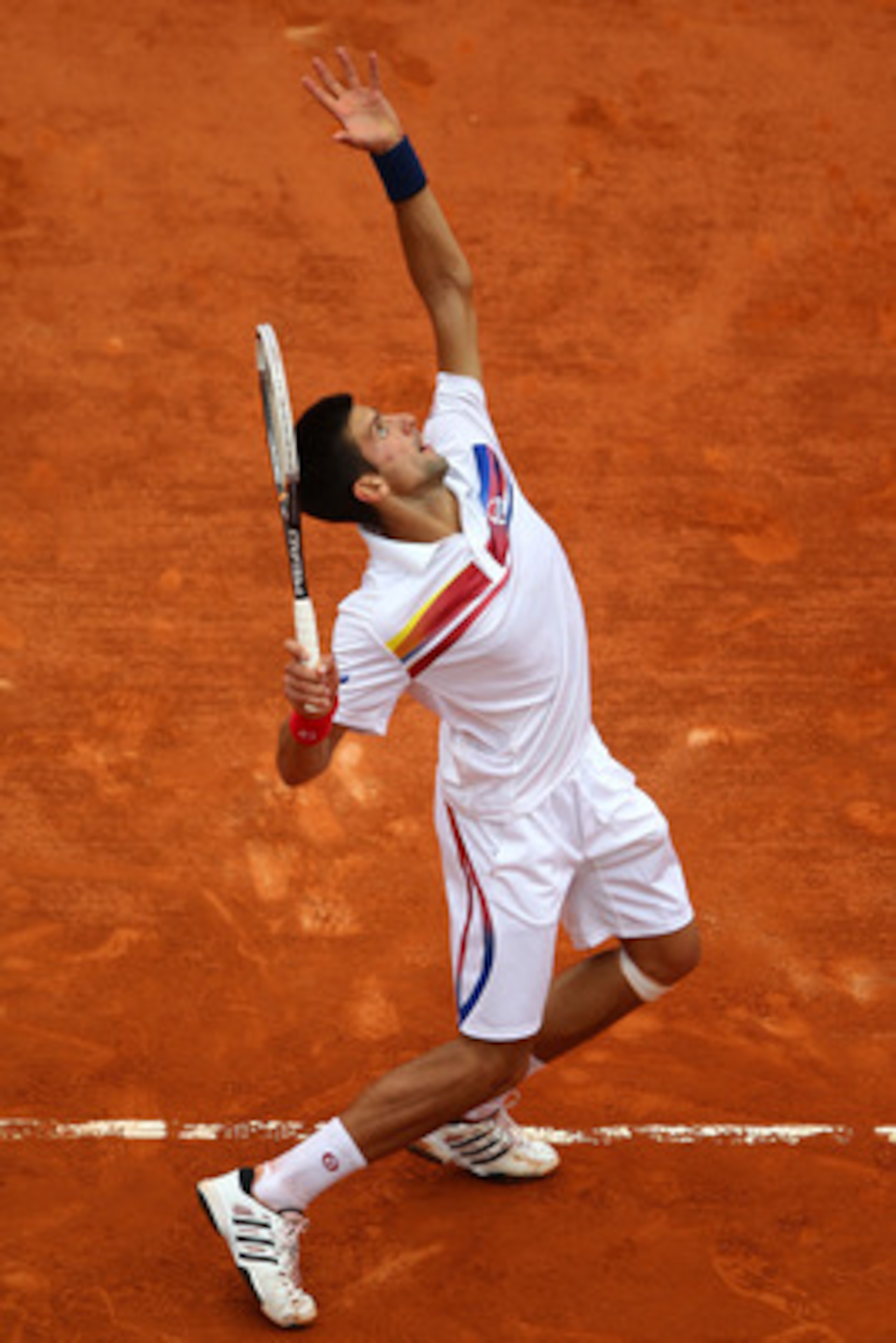 PARIS, FRANCE - JUNE 03:  Novak Djokovic of Serbia serves during the men's singles semi final match between Roger Federer of Switzerland and Novak Djokovic of Serbia on day thirteen of the French Open at Roland Garros on June 3, 2011 in Paris, France.  (P