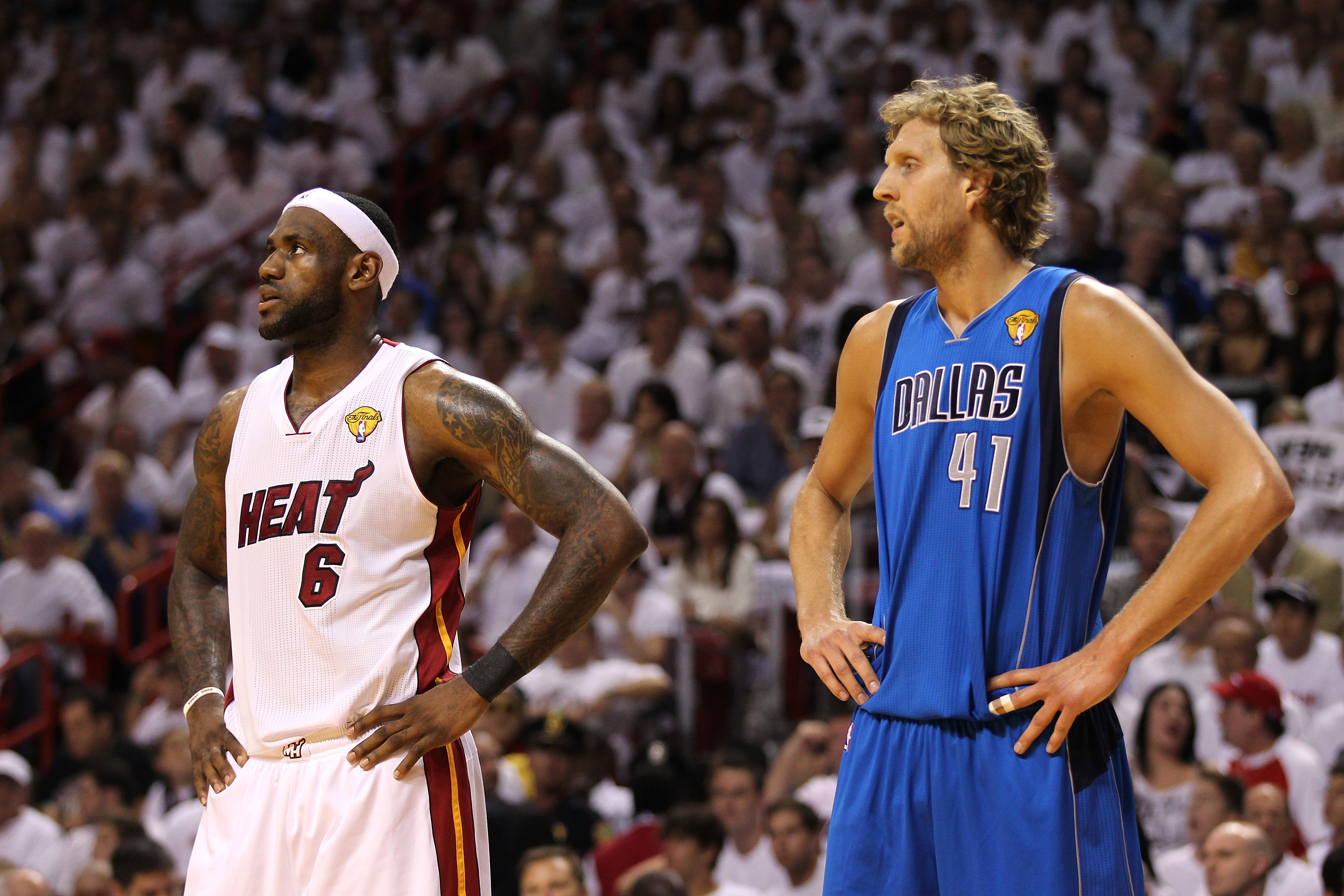 MIAMI, FL - JUNE 12: (L-R) LeBron James #6 of the Miami Heat and Dirk Nowitzki #41 of the Dallas Mavericks look on in Game Six of the 2011 NBA Finals at American Airlines Arena on June 12, 2011 in Miami, Florida. The Mavericks won 105-95. NOTE TO USER: Us