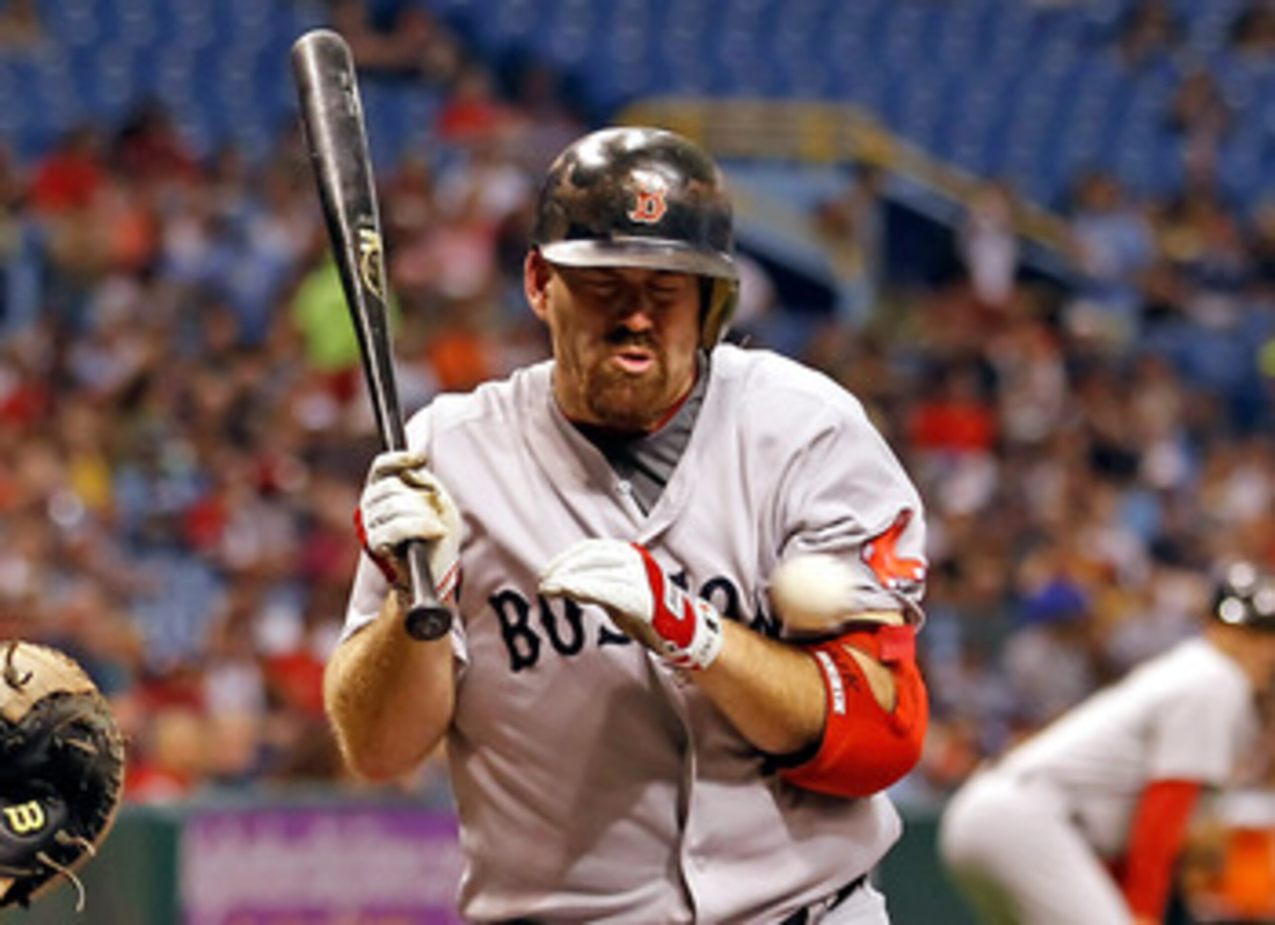 ST. PETERSBURG, FL - JUNE 16:  Infielder Kevin Youkilis #20 of the Boston Red Sox is hit by a pitch in the first inning against the Tampa Bay Rays during the game at Tropicana Field on June 16, 2011 in St. Petersburg, Florida.  (Photo by J. Meric/Getty Im