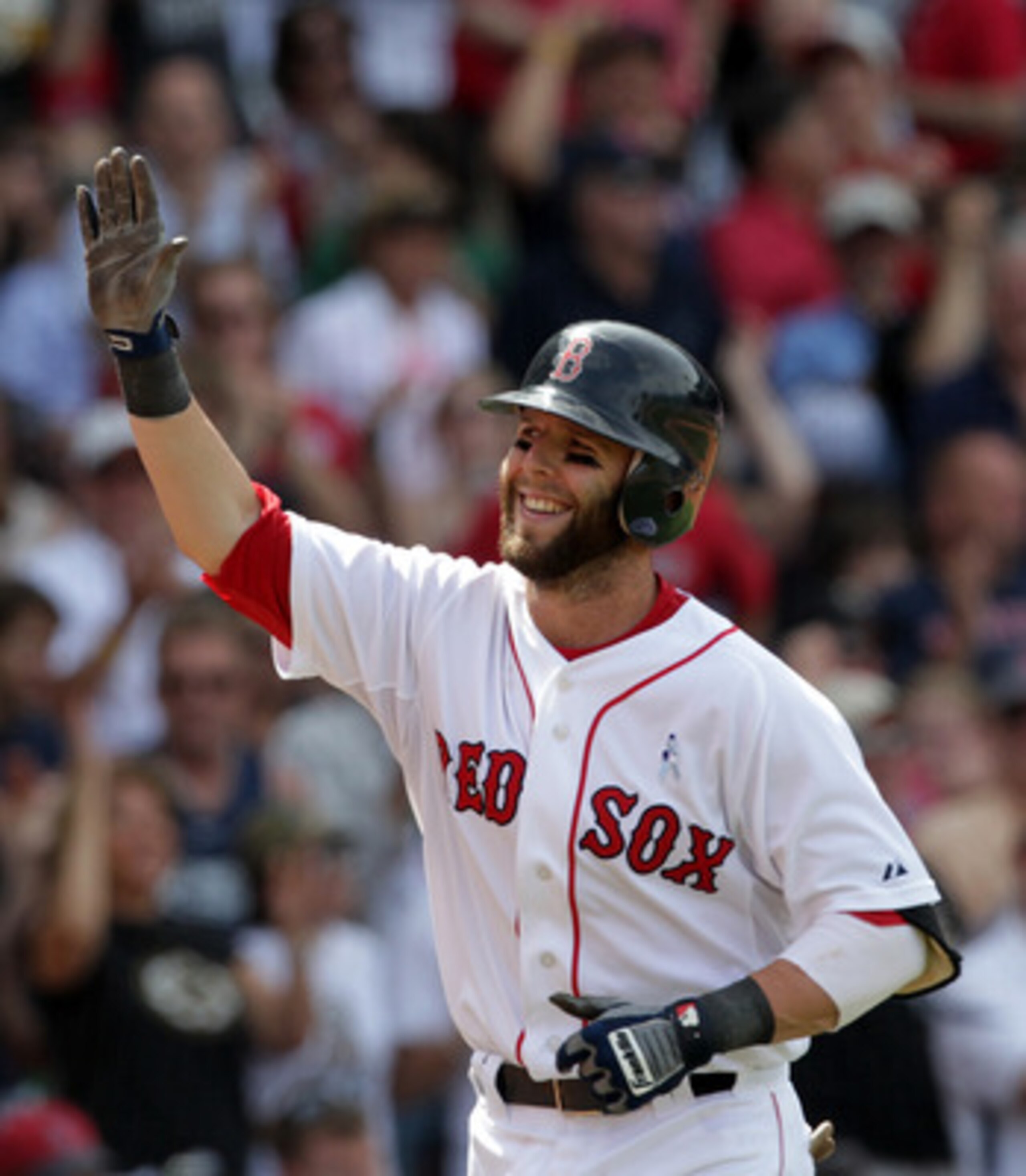 BOSTON, MA  - JUNE 19:  Dustin Pedroia #15 of the Boston Red Sox reacts after hitting a home run against of the Milwaukee Brewers at Fenway Park on June 19, 2011 in Boston, Massachusetts.  (Photo by Jim Rogash/Getty Images)