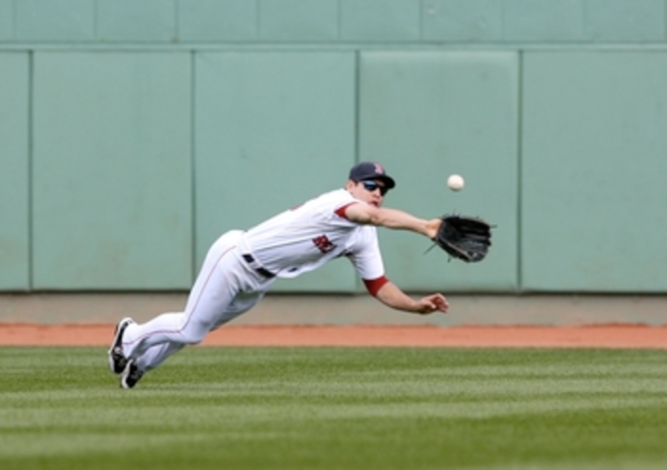 BOSTON - OCTOBER 11:  Jacoby Ellsbury #46 of the Boston Red Sox makes a diving catch on a Bobby Abreu #53 of the Los Angeles Angels of Anaheim flyout in the third inning of Game Three of the ALDS during the 2009 MLB Playoffs at Fenway Park on October 11, 