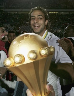 CAIRO, EGYPT - FEBRUARY 10: Mido of Egypt with the trophy after his country wins the The African Cup of Nations Final between Egypt and the Ivory Coast at The Cairo International Stadium on February 10, 2006 in Cairo, Egypt.  (Photo by Ben Radford/Getty I