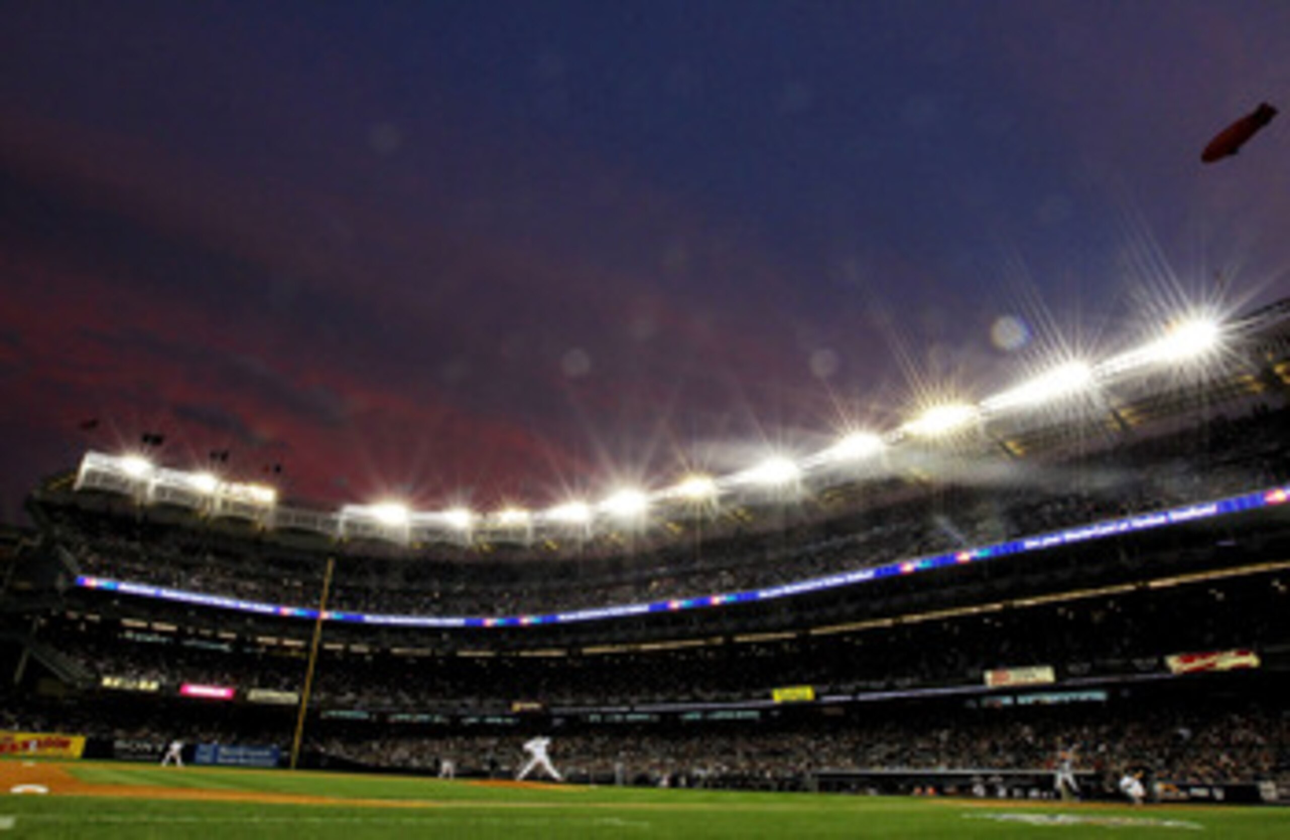 NEW YORK - OCTOBER 20:  CC Sabathia #52 of the New York Yankees pitches against the Texas Rangers in Game Five of the ALCS during the 2010 MLB Playoffs at Yankee Stadium on October 20, 2010 in the Bronx borough of New York City.  (Photo by Al Bello/Getty 