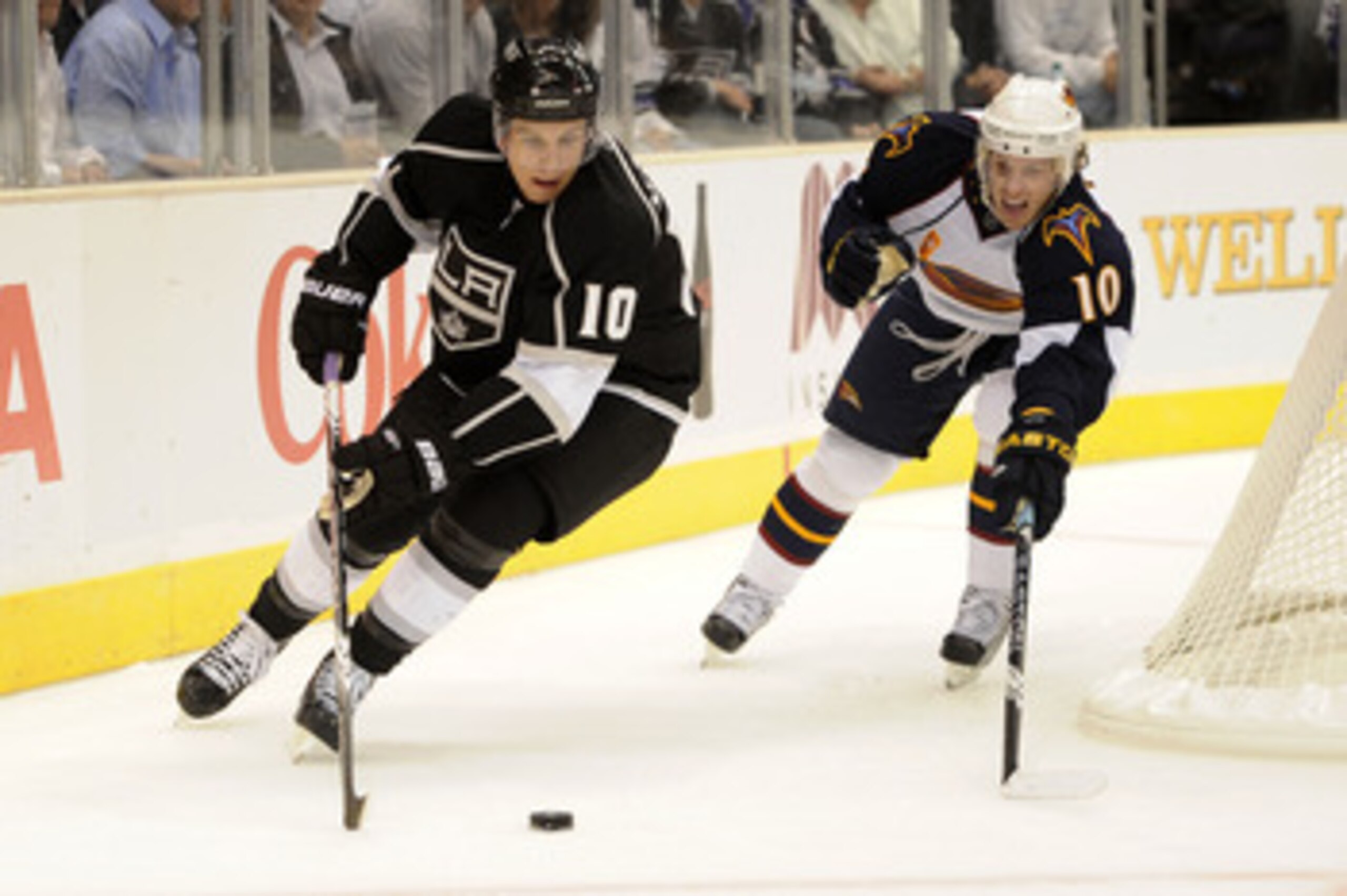 LOS ANGELES, CA - OCTOBER 12:  Brayden Schenn #10 of the Los Angeles Kings controls the puck against Bryan Little #10 of the Atlanta Thrashers during their game at Staples Center on October 12, 2010 in Los Angeles, California.  (Photo by Harry How/Getty I