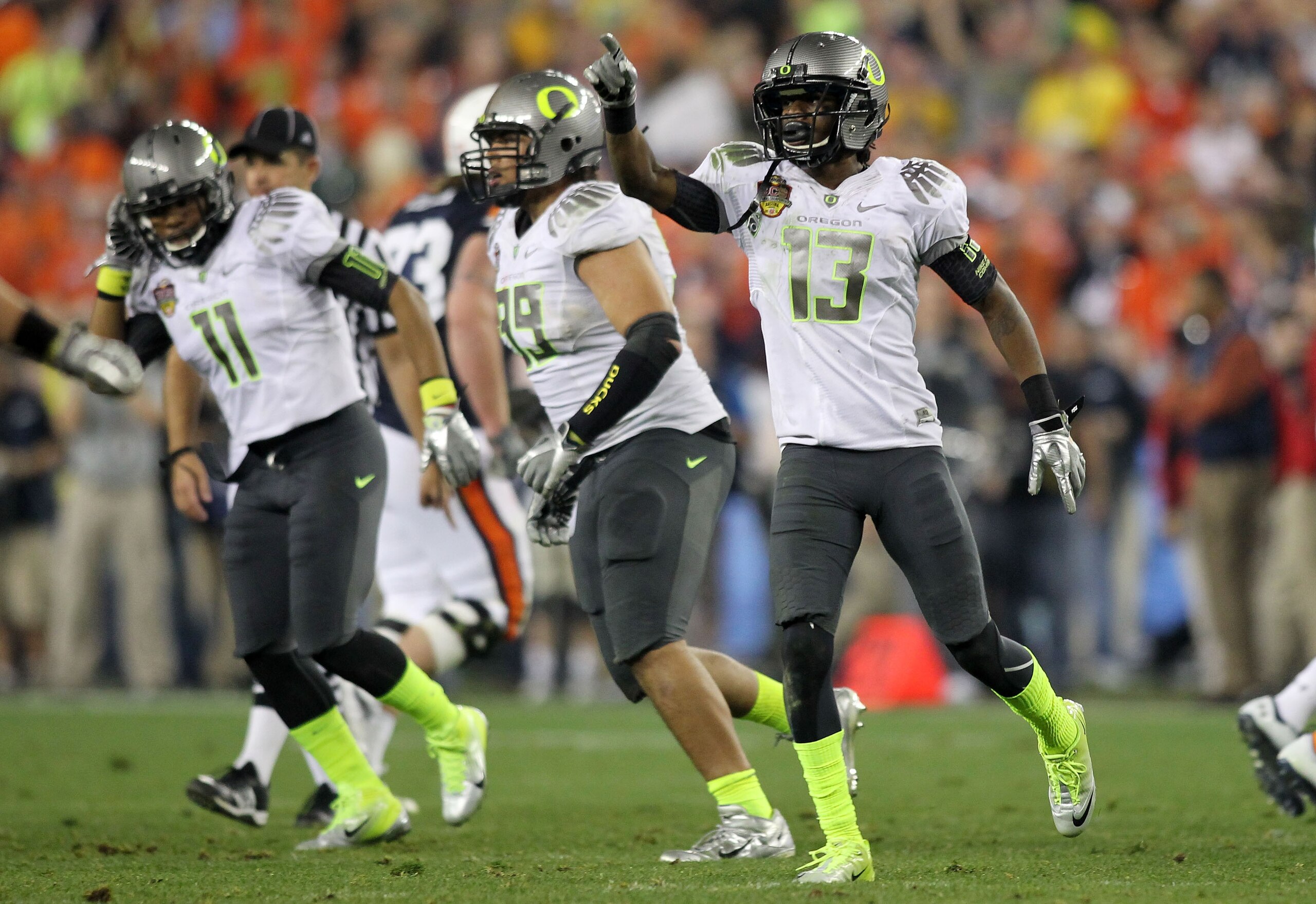GLENDALE, AZ - JANUARY 10:  Cliff Harris #13 of the Oregon Ducks reacts during their game against the Auburn Tigers during the Tostitos BCS National Championship Game at University of Phoenix Stadium on January 10, 2011 in Glendale, Arizona.  (Photo by Jo