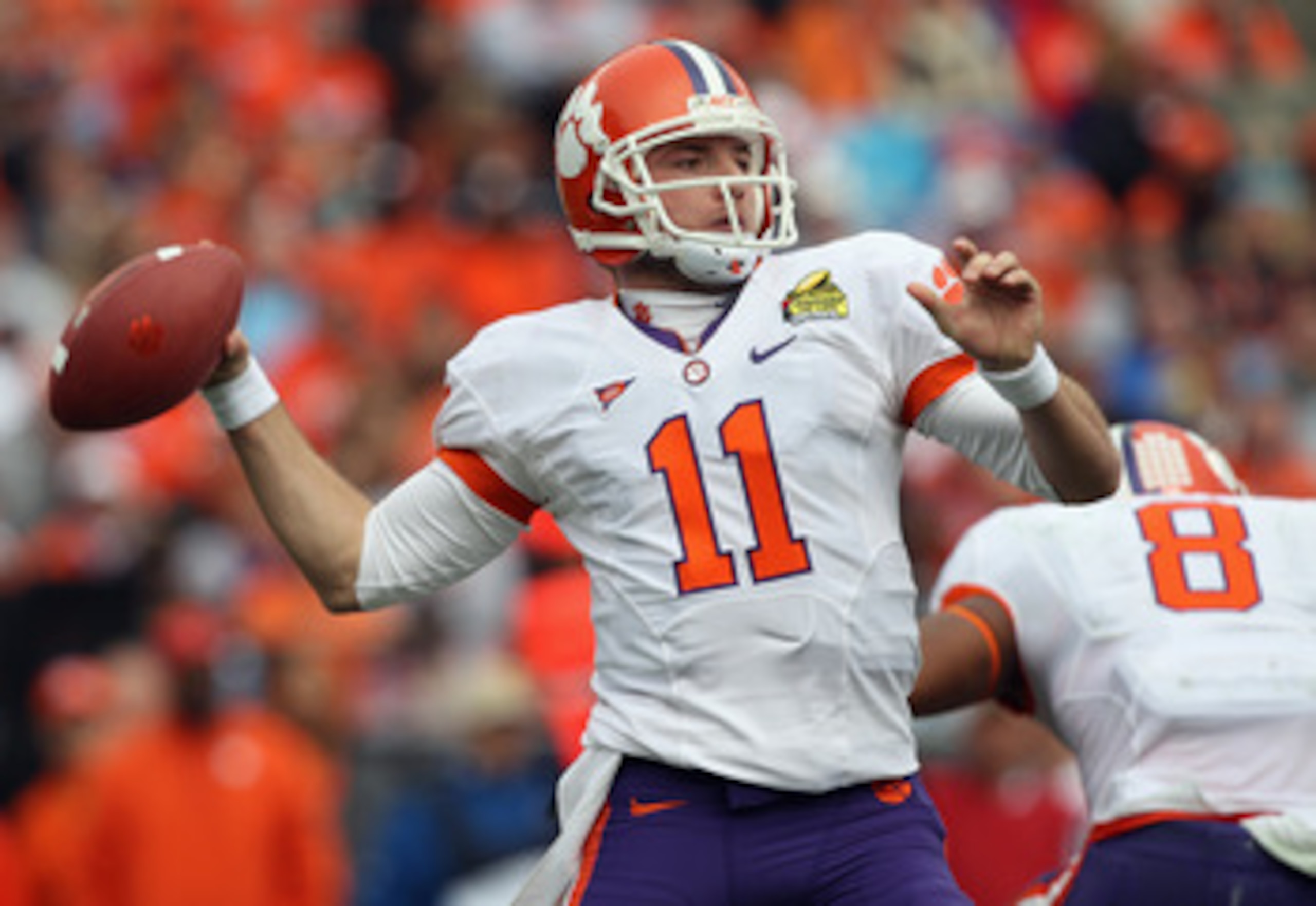 CHARLOTTE, NC - DECEMBER 31:  Kyle Parker #11 of the Clemson Tigers drops back to throw a pass against the USF Bulls during their game at Bank of America Stadium on December 31, 2010 in Charlotte, North Carolina.  (Photo by Streeter Lecka/Getty Images)