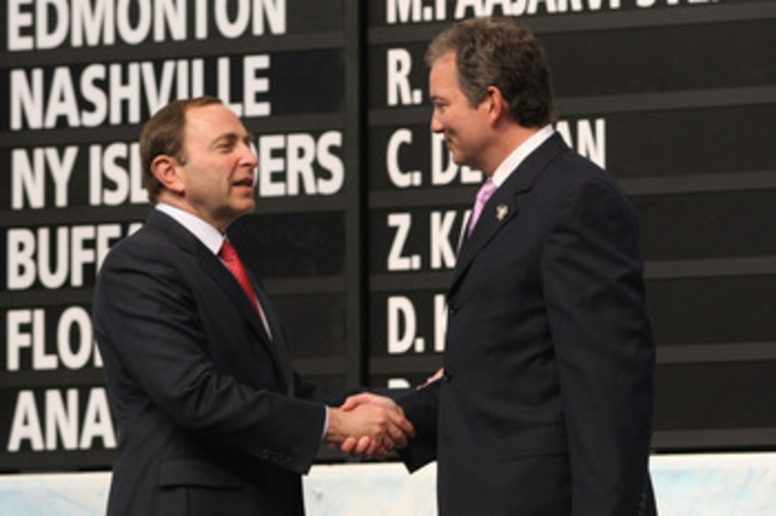 MONTREAL, QC - JUNE 26:  Executive Vice President and General Manager Ray Shero of the Pittsburgh Penguins greets NBA Commissioner Gary Bettman on stage during the first round of the 2009 NHL Entry Draft at the Bell Centre on June 26, 2009 in Montreal, Qu
