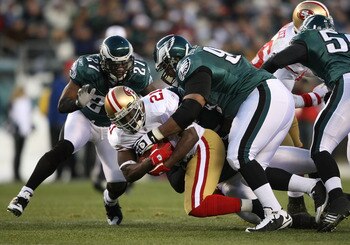 PHILADELPHIA - DECEMBER 20:  Frank Gore #21 of the San Francisco 49ers is tackled by Brodrick Bunkley #97 of the Philadelphia Eagles at Lincoln Financial Field on December 20, 2009 in Philadelphia, Pennsylvania.  (Photo by Nick Laham/Getty Images)