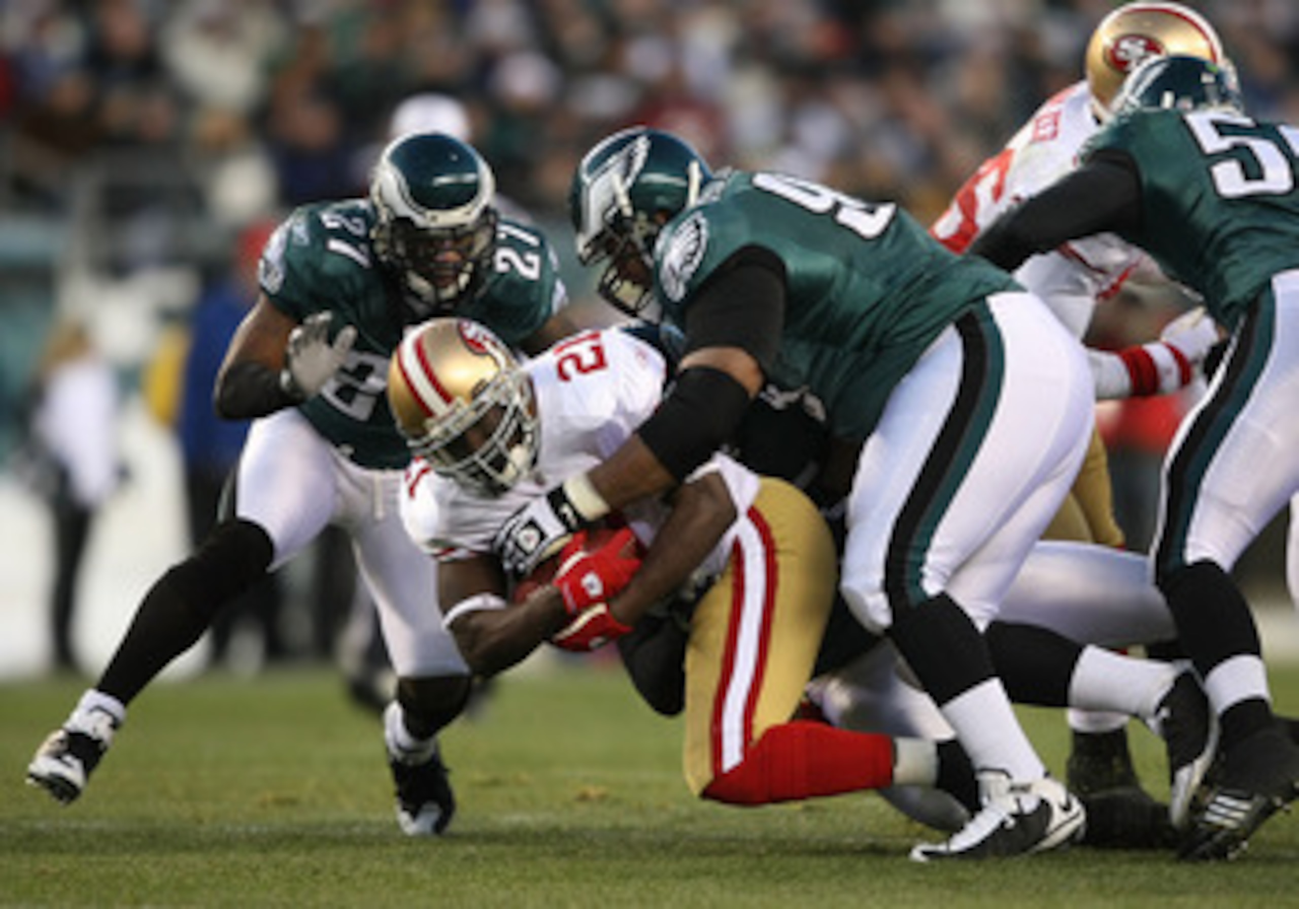PHILADELPHIA - DECEMBER 20:  Frank Gore #21 of the San Francisco 49ers is tackled by Brodrick Bunkley #97 of the Philadelphia Eagles at Lincoln Financial Field on December 20, 2009 in Philadelphia, Pennsylvania.  (Photo by Nick Laham/Getty Images)