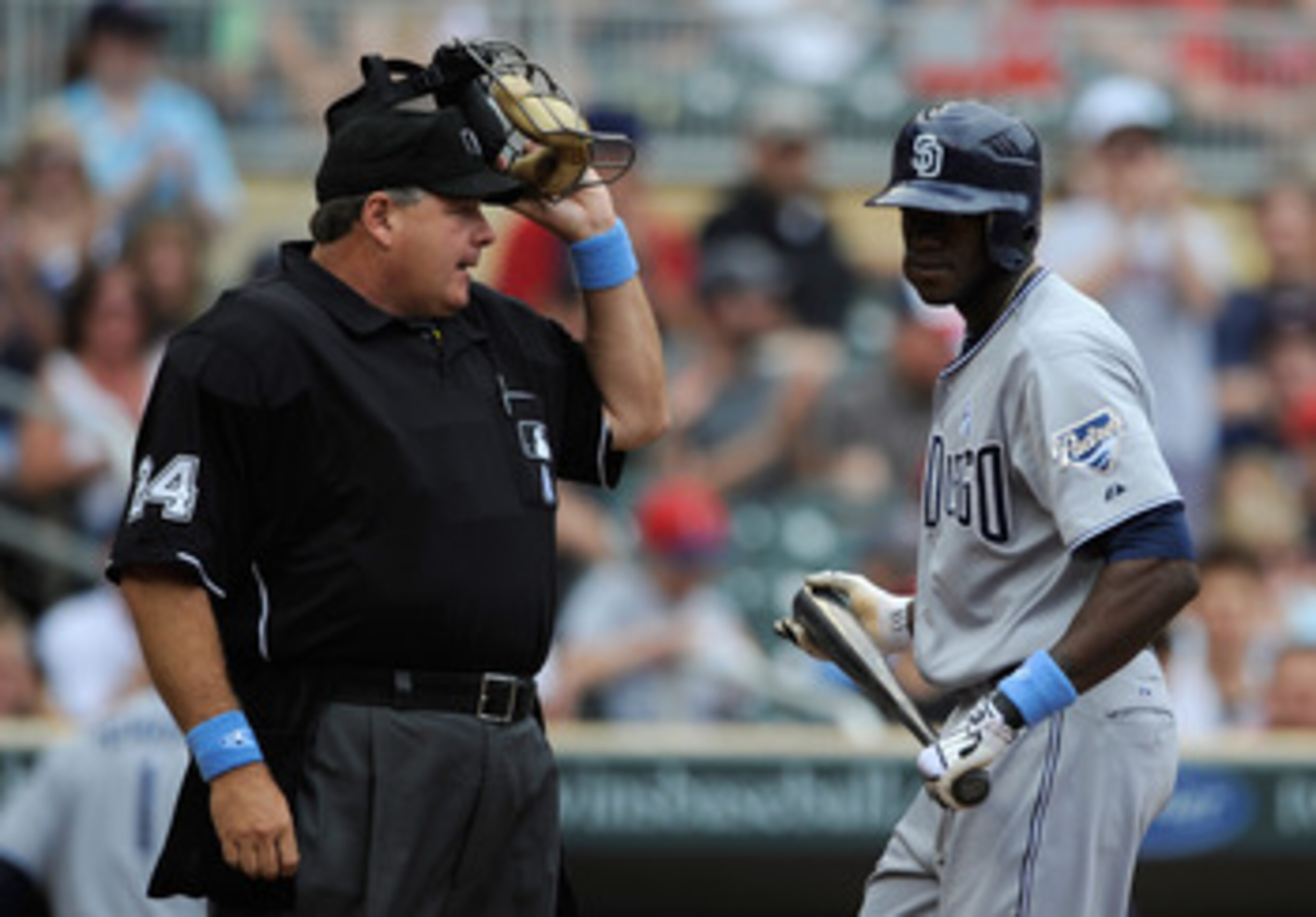 MINNEAPOLIS, MN - JUNE 19: Cameron Maybin #24 of the San Diego Padres speaks with home plate umpire Jerry Layne #24 after striking out in the second inning on June 19, 2011 at Target Field in Minneapolis, Minnesota. The Twins defeated the Padres 5-4. (Pho