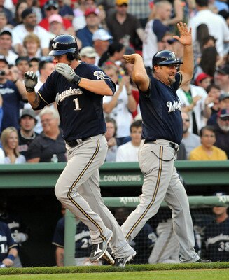 BOSTON, MA - JUNE 18:  Corey Hart #1 of the Milwaukee Brewers gets a high five from third base coach Garth Lorg after hitting a homerun in the first inning against the Boston Red Sox at Fenway Park on June 18, 2011 in Boston, Massachusetts. (Photo by Darr