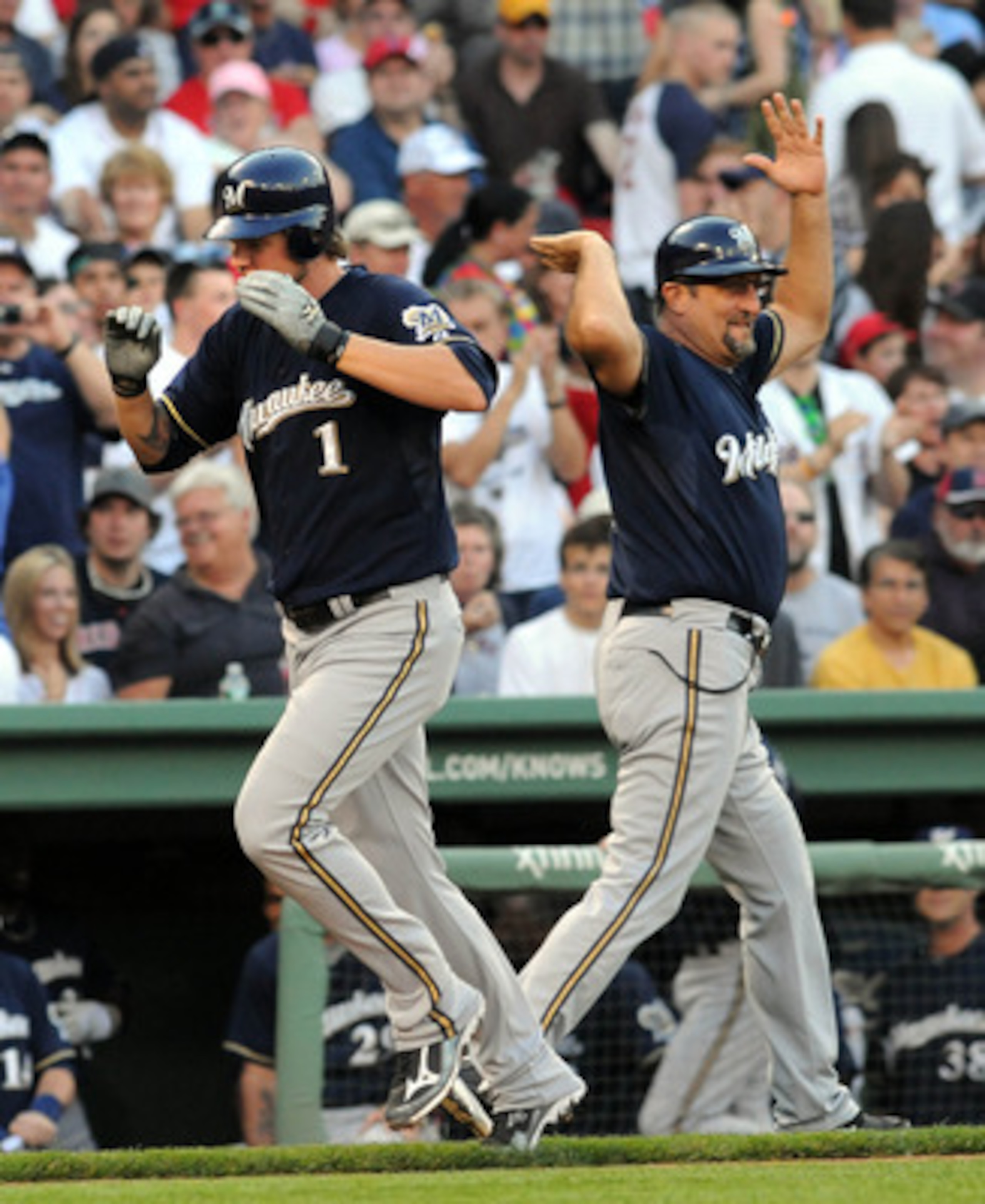 BOSTON, MA - JUNE 18:  Corey Hart #1 of the Milwaukee Brewers gets a high five from third base coach Garth Lorg after hitting a homerun in the first inning against the Boston Red Sox at Fenway Park on June 18, 2011 in Boston, Massachusetts. (Photo by Darr