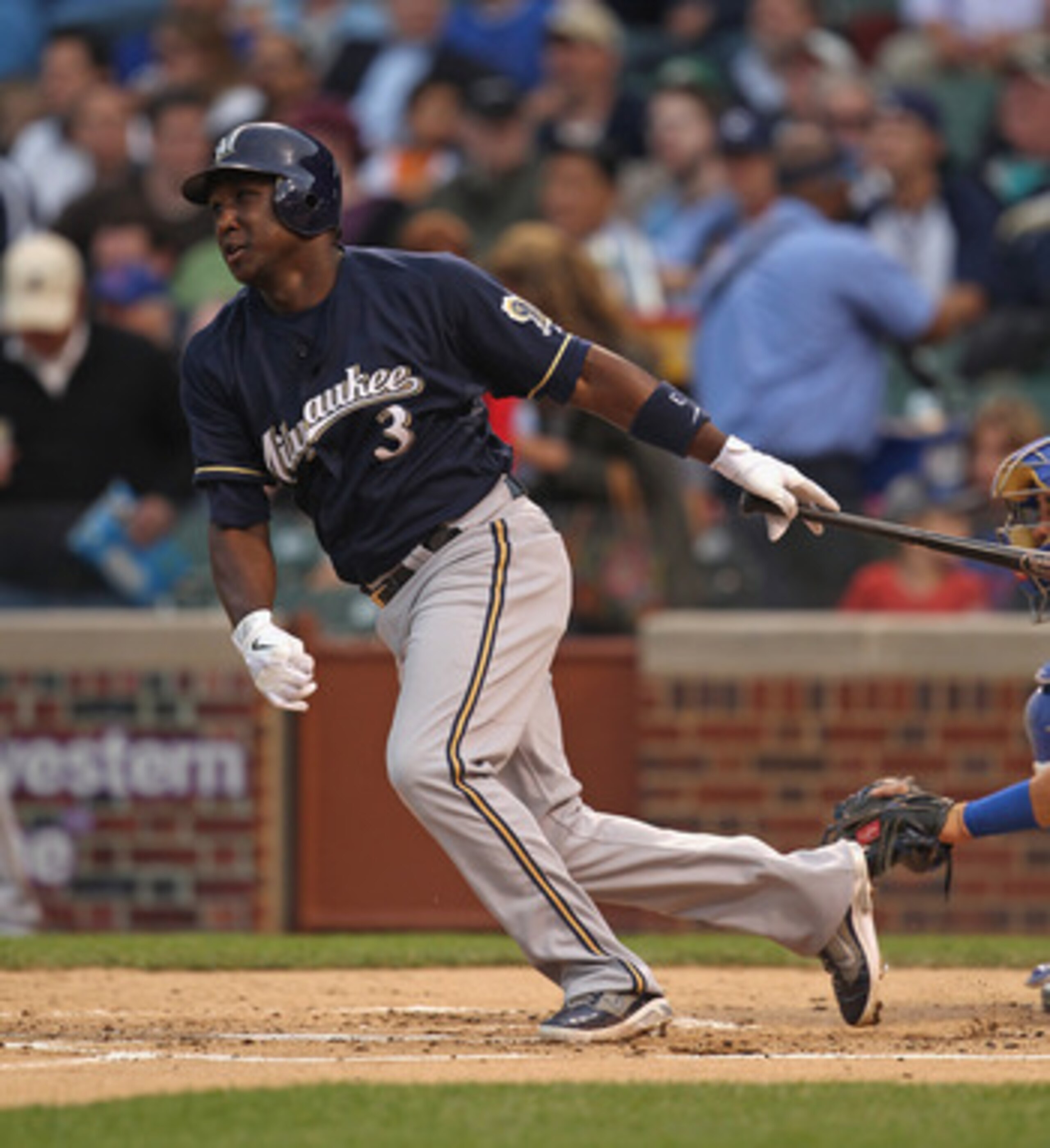 CHICAGO, IL - JUNE 14:  Yuniesky Betancourt #3 of the Milwaukee Brewers takes a swing against the Chicago Cubs at Wrigley Field on June 14, 2011 in Chicago, Illinois. The Cubs defeated the Brewers 5-4 in 10 innings.  (Photo by Jonathan Daniel/Getty Images