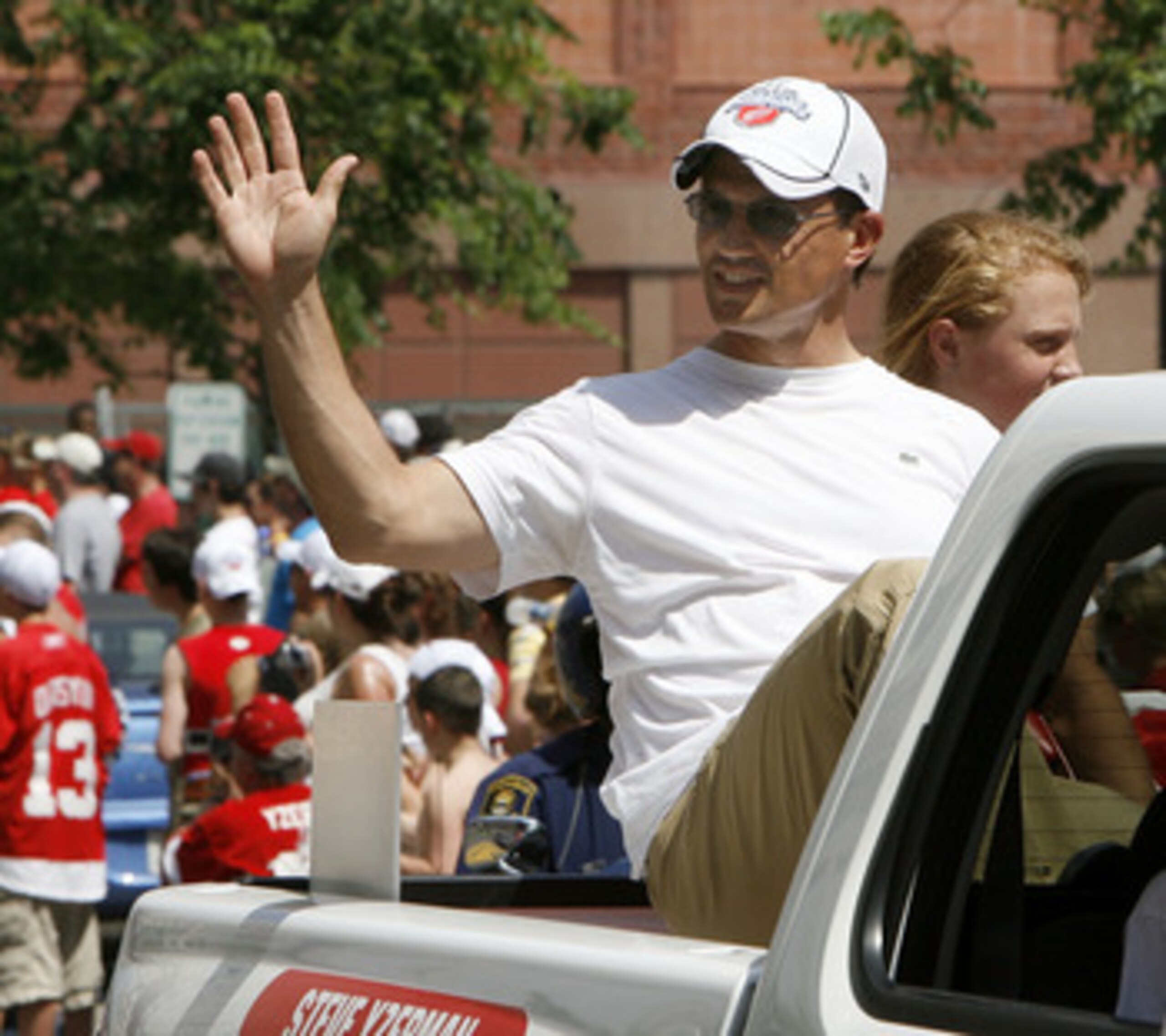 DETROIT - JUNE 06: Steve Yzerman vice president of the Detroit Red Wings reacts to fans during a parade to celebrate winning the 2008 Stanley Cup on June 6, 2008 in Detroit, Michigan.  (Photo by Gregory Shamus/Getty Images)