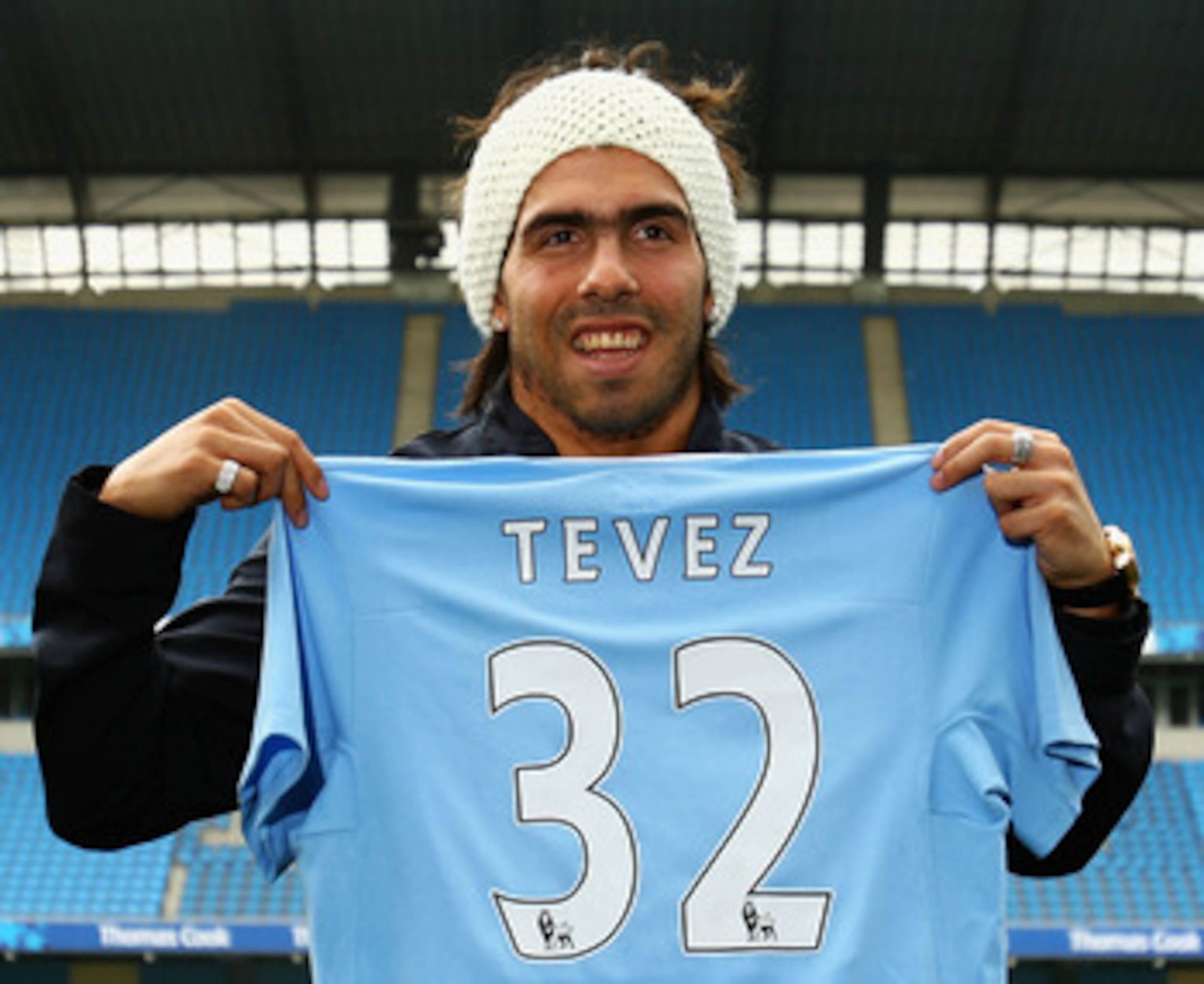 MANCHESTER, ENGLAND - JULY 14:  Carlos Tevez poses as he is unveilled at the City of Manchester Stadium after signing for Manchester City on July 14, 2009 in Manchester, England.  (Photo by Matthew Lewis/Getty Images)