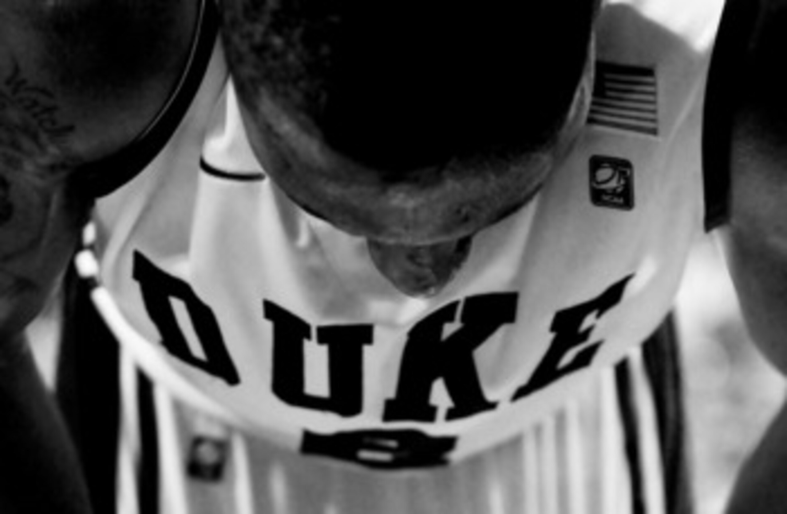 GREENSBORO, NC - MARCH 11:  (EDITORS NOTE: Image has been converted to black and white.) Nolan Smith #2 of the Duke Blue Devils stands on his feet after being injured during the second half of the game against the Maryland Terrapins in the quarterfinals o