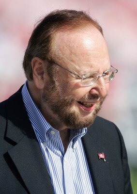 TAMPA, FL - JANUARY 1:  Owner Malcolm Glazer of the Tampa Bay Buccaneers stands on the sideline during the game with the New Orleans Saints at Raymond James Stadium on January 1, 2006 in Tampa, Florida. The Buccaneers defeated the Saints 27-13 to win the 