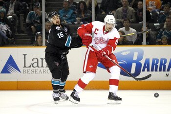 SAN JOSE, CA - MAY 08:  Devin Setoguchi #16 of the San Jose Sharks and Nicklas Lidstrom #5 of the Detroit Red Wings go for the puck in Game Five of the Western Conference Semifinals during the 2011 NHL Stanley Cup Playoffs at HP Pavilion on May 8, 2011 in
