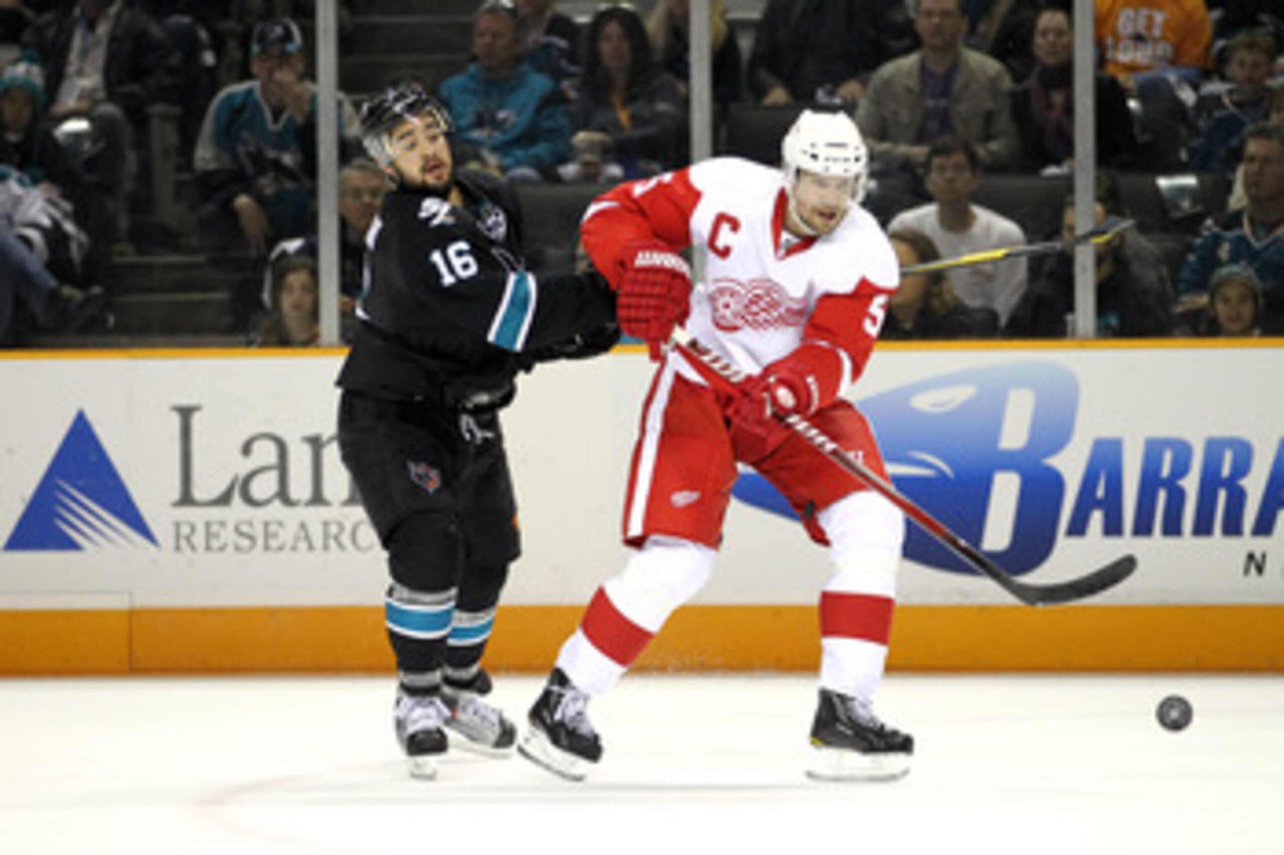 SAN JOSE, CA - MAY 08:  Devin Setoguchi #16 of the San Jose Sharks and Nicklas Lidstrom #5 of the Detroit Red Wings go for the puck in Game Five of the Western Conference Semifinals during the 2011 NHL Stanley Cup Playoffs at HP Pavilion on May 8, 2011 in