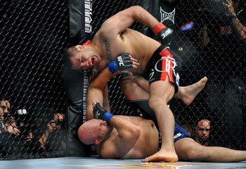 LOS ANGELES, CA - OCTOBER 24:  UFC fighter Cain Velasquez (top) battles with UFC fighter Ben Rothwell (bottom) during their Heavyweight bout at UFC 104: Machida vs. Shogun at Staples Center on October 24, 2009 in Los Angeles, California.  (Photo by Jon Ko