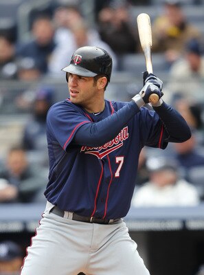 NEW YORK, NY - APRIL 07:  Joe Mauer #7 of the Minnesota Twins against New York Yankees at Yankee Stadium on April 7, 2011 in the Bronx borough of New York City.  (Photo by Nick Laham/Getty Images)