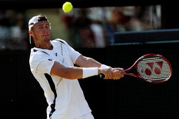 LONDON, ENGLAND - JUNE 28:  Lleyton Hewitt of Australia in action during his match against Novak Djokovic of Serbia on Day Seven of the Wimbledon Lawn Tennis Championships at the All England Lawn Tennis and Croquet Club on June 28, 2010 in London, England