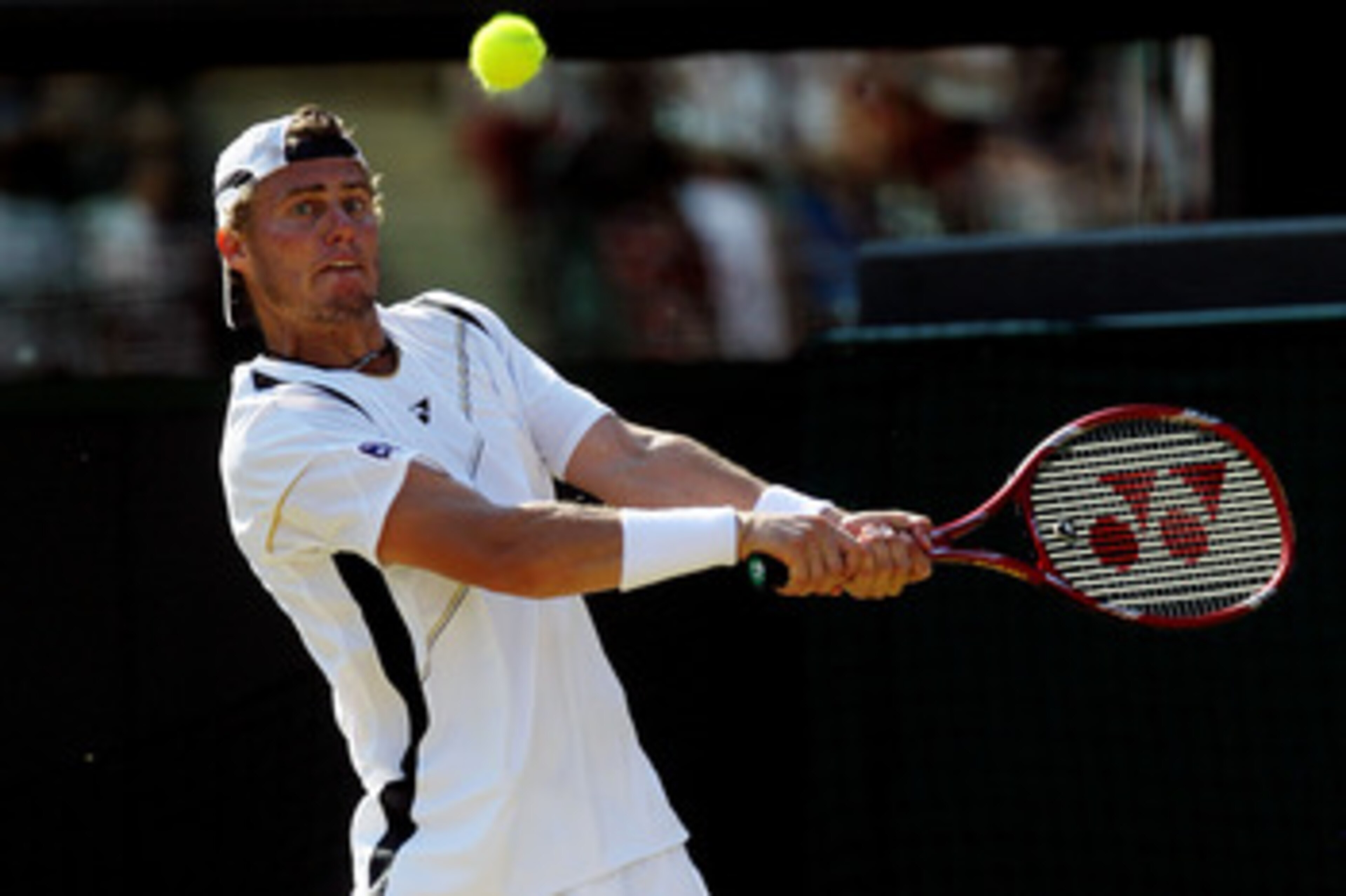 LONDON, ENGLAND - JUNE 28:  Lleyton Hewitt of Australia in action during his match against Novak Djokovic of Serbia on Day Seven of the Wimbledon Lawn Tennis Championships at the All England Lawn Tennis and Croquet Club on June 28, 2010 in London, England