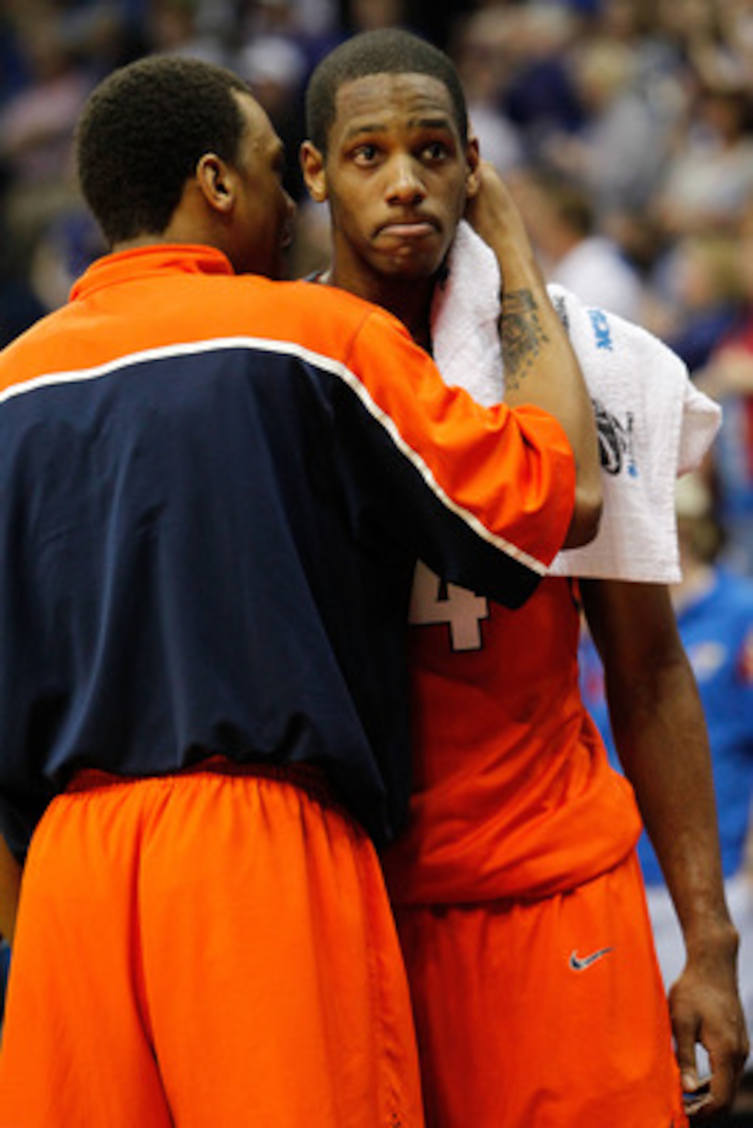 TULSA, OK - MARCH 20:  Mike Davis #24 of the Illinois Fighting Illini is hugged by Jereme Richmond #22 in the final moments of their 59-73 loss to the Kansas Jayhawks the third round of the 2011 NCAA men's basketball tournament at BOK Center on March 20,