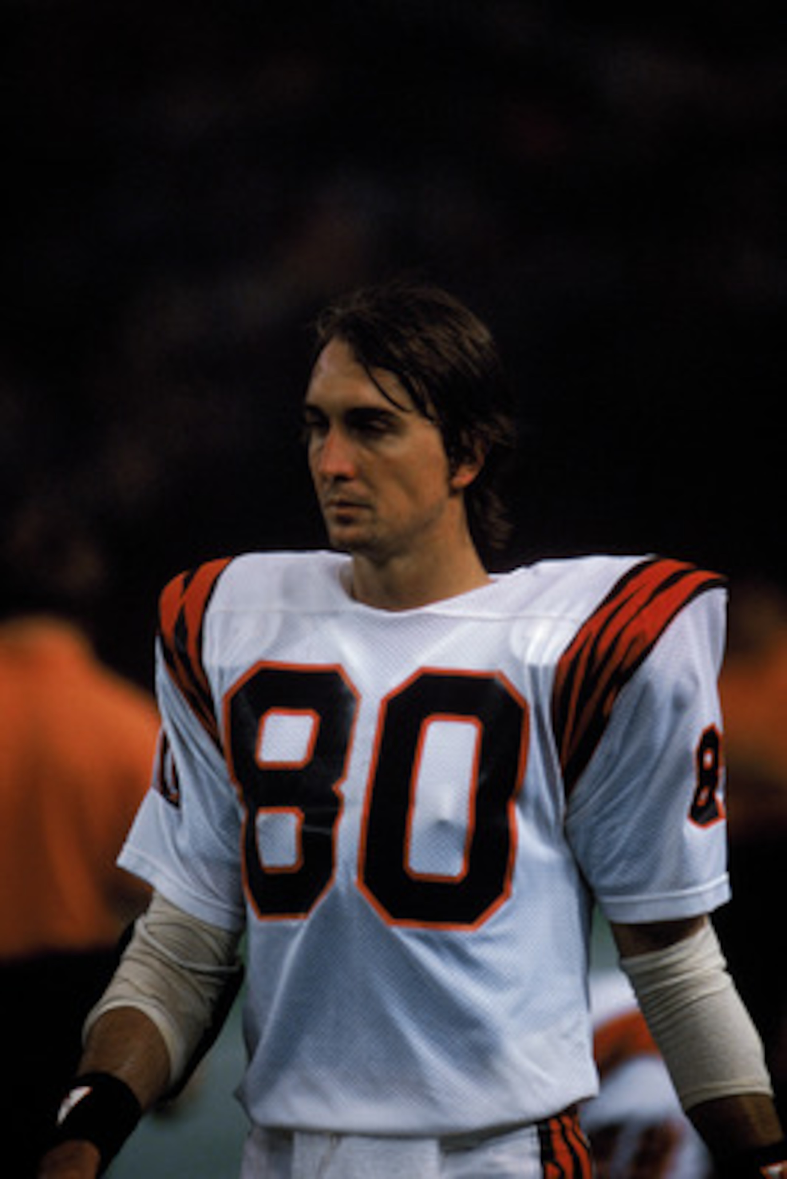 HOUSTON - 1985:  Wide receiver Cris Collinsworth #80 of the Cincinnati Bengals walks on the field during a game in the 1985 NFL Season against the Houston Oilers at the Houston Astrodome in Houston, Texas.  (Photo by Tony Duffy/Getty Images)
