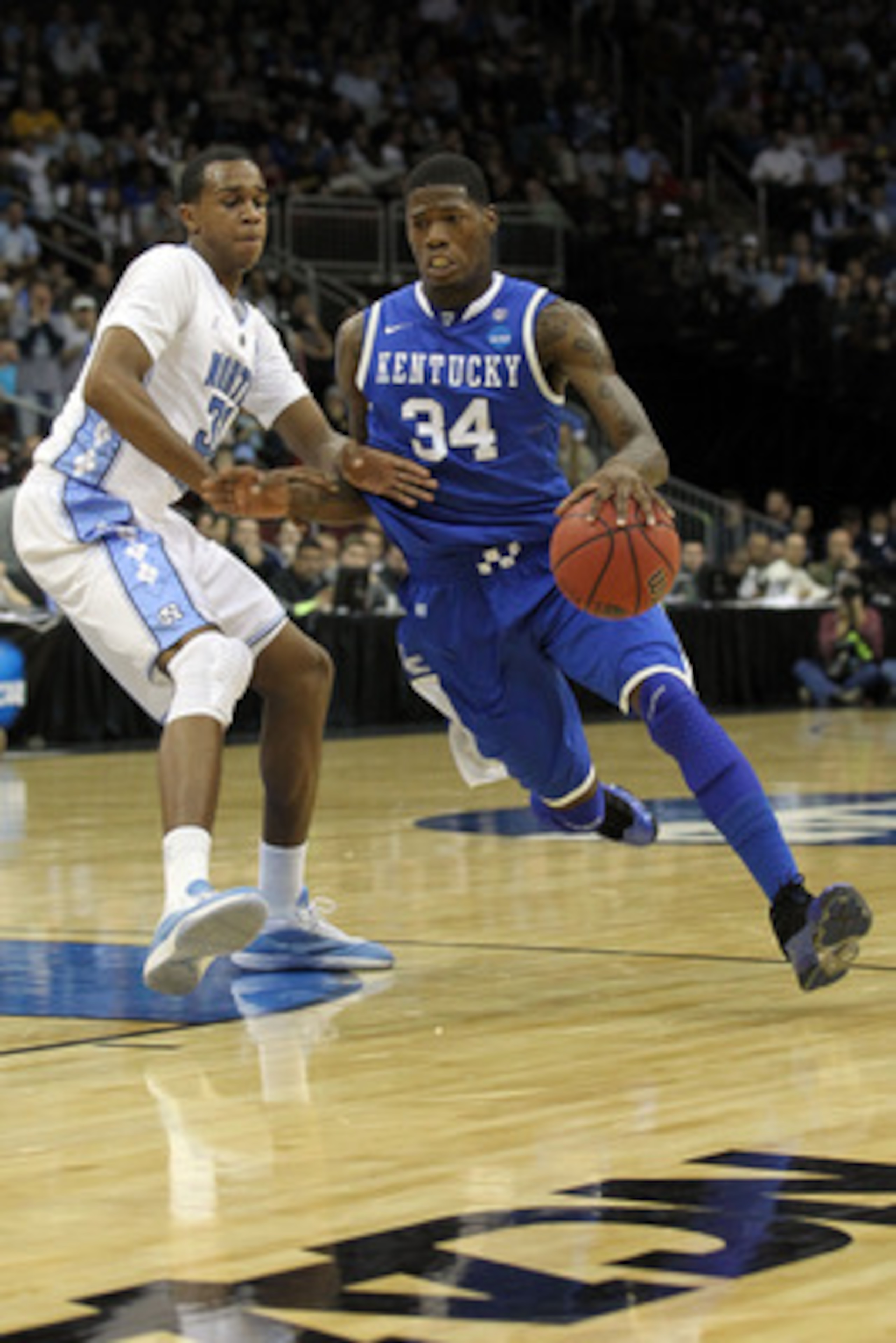 NEWARK, NJ - MARCH 27:  DeAndre Liggins #34 of the Kentucky Wildcats in action against John Henson #31 of the North Carolina Tar Heels during the east regional final of the 2011 NCAA men's basketball tournament at Prudential Center on March 27, 2011 in Ne