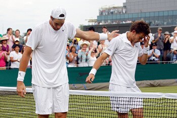 LONDON, ENGLAND - JUNE 24:  Nicolas Mahut of France (R) after losing on the third day of his first round match against John Isner of USA (R) on Day Four of the Wimbledon Lawn Tennis Championships at the All England Lawn Tennis and Croquet Club on June 24,