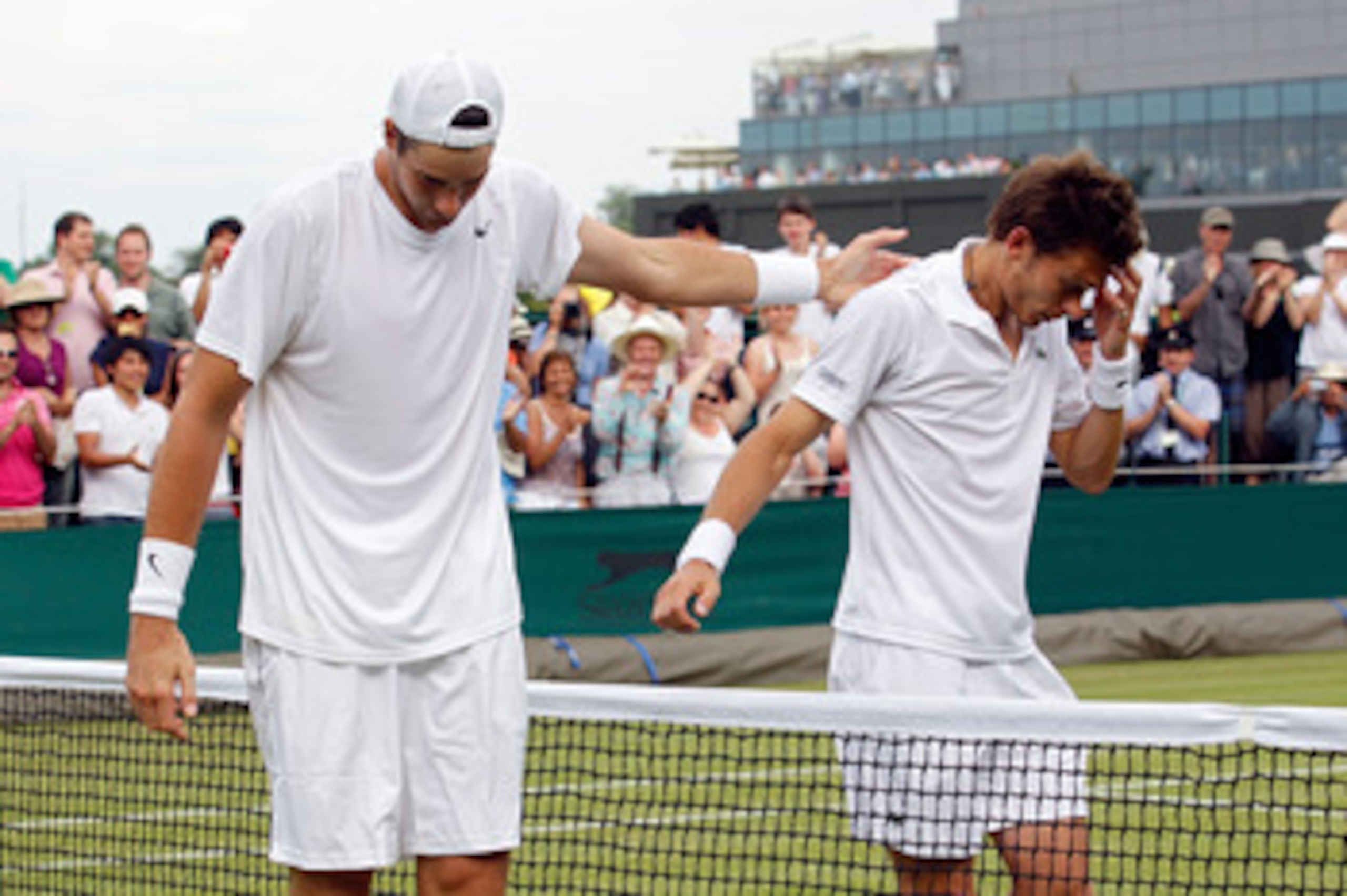 LONDON, ENGLAND - JUNE 24:  Nicolas Mahut of France (R) after losing on the third day of his first round match against John Isner of USA (R) on Day Four of the Wimbledon Lawn Tennis Championships at the All England Lawn Tennis and Croquet Club on June 24,