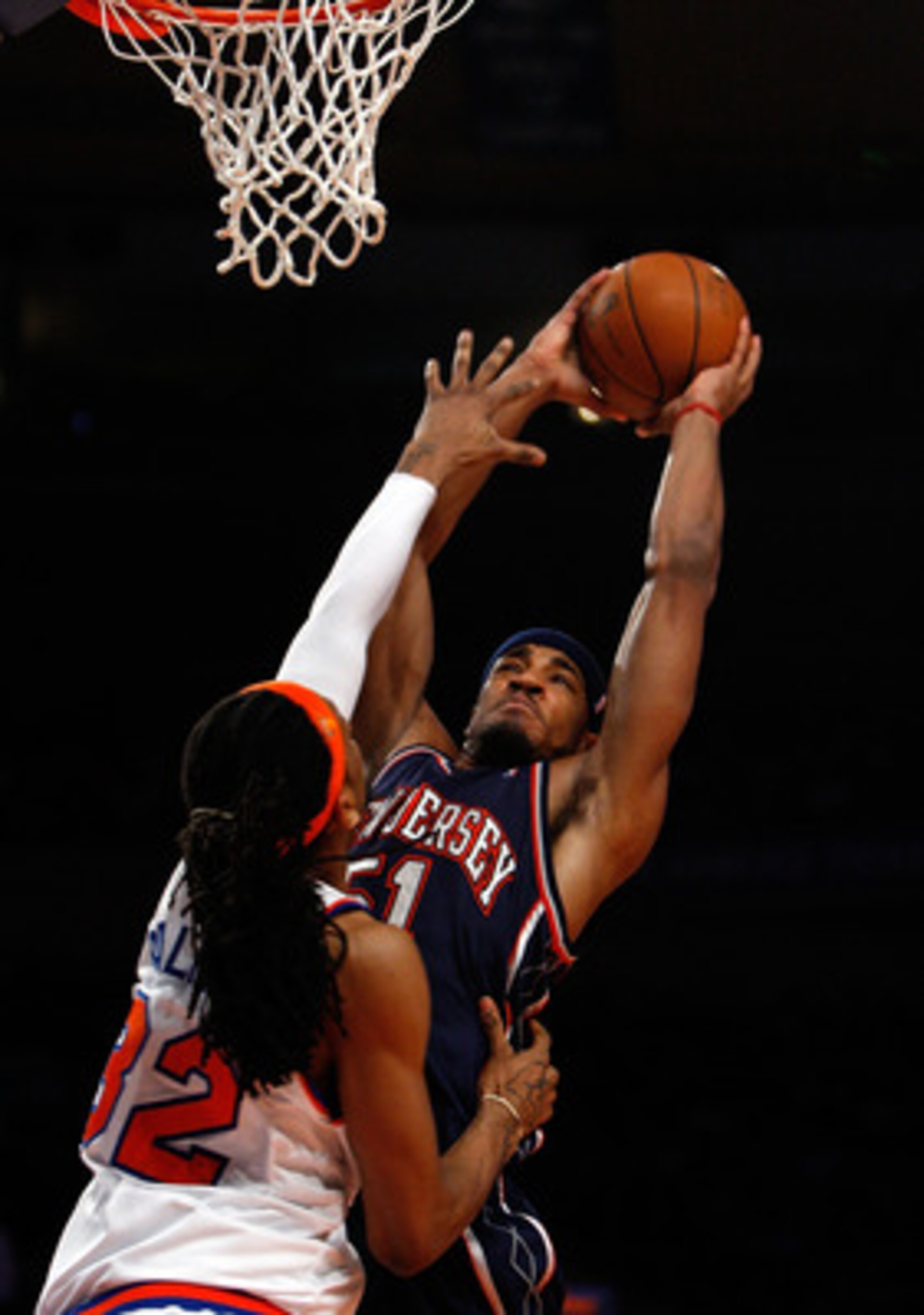 NEW YORK - MARCH 24:  Sean Williams #51 of the New Jersey Nets is fouled by Renaldo Balkman #32 of the New York Knicks on March 24, 2008 at Madison Square Garden in New York City. NOTE TO USER: User expressly acknowledges and agrees that, by downloading a