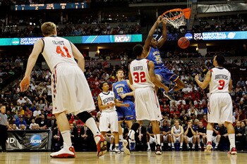 DENVER, CO - MARCH 19:  Kenneth Faried #35 of the Morehead State Eagles dunks the ball against Justin Harper #32 and Darien Brothers #3 of the Richmond Spiders during the third round of the 2011 NCAA men's basketball tournament at Pepsi Center on March 19