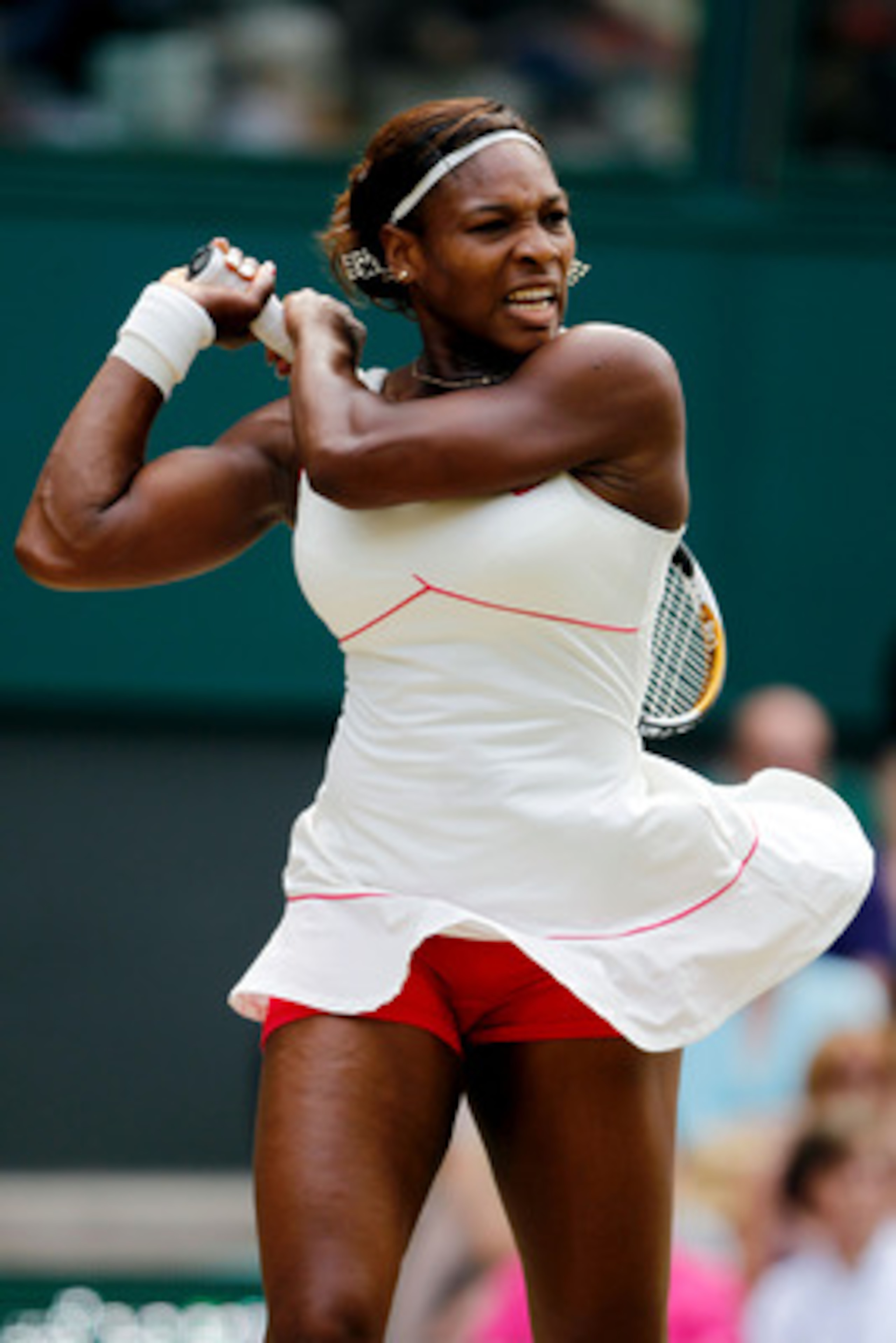 LONDON, ENGLAND - JULY 03:  Serena Williams of USA returns a shot during the Ladies Singles Final Match against Vera Zvonareva of Russia on Day Twelve of the Wimbledon Lawn Tennis Championships at the All England Lawn Tennis and Croquet Club on July 3, 20
