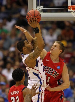 SAN ANTONIO, TX - MARCH 25:  Markieff Morris #21 of the Kansas Jayhawks goes to the basket against Josh Duinker #11 of the Richmond Spiders during the southwest regional of the 2011 NCAA men's basketball tournament at the Alamodome on March 25, 2011 in Sa