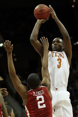 KANSAS CITY, MO - MARCH 10:  Jordan Hamilton #3 of the Texas Longhorns takes a shot over Steven Pledger #2 of the Oklahoma Sooners during their quarterfinal game in the 2011 Phillips 66 Big 12 Men's Basketball Tournament at Sprint Center on March 10, 2011
