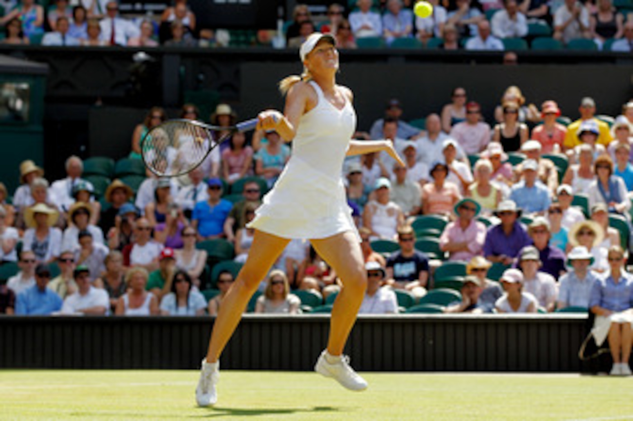 LONDON, ENGLAND - JUNE 28:  Maria Sharapova of Russia in action during her match against Serena Williams of USA on Day Seven of the Wimbledon Lawn Tennis Championships at the All England Lawn Tennis and Croquet Club on June 28, 2010 in London, England.  (