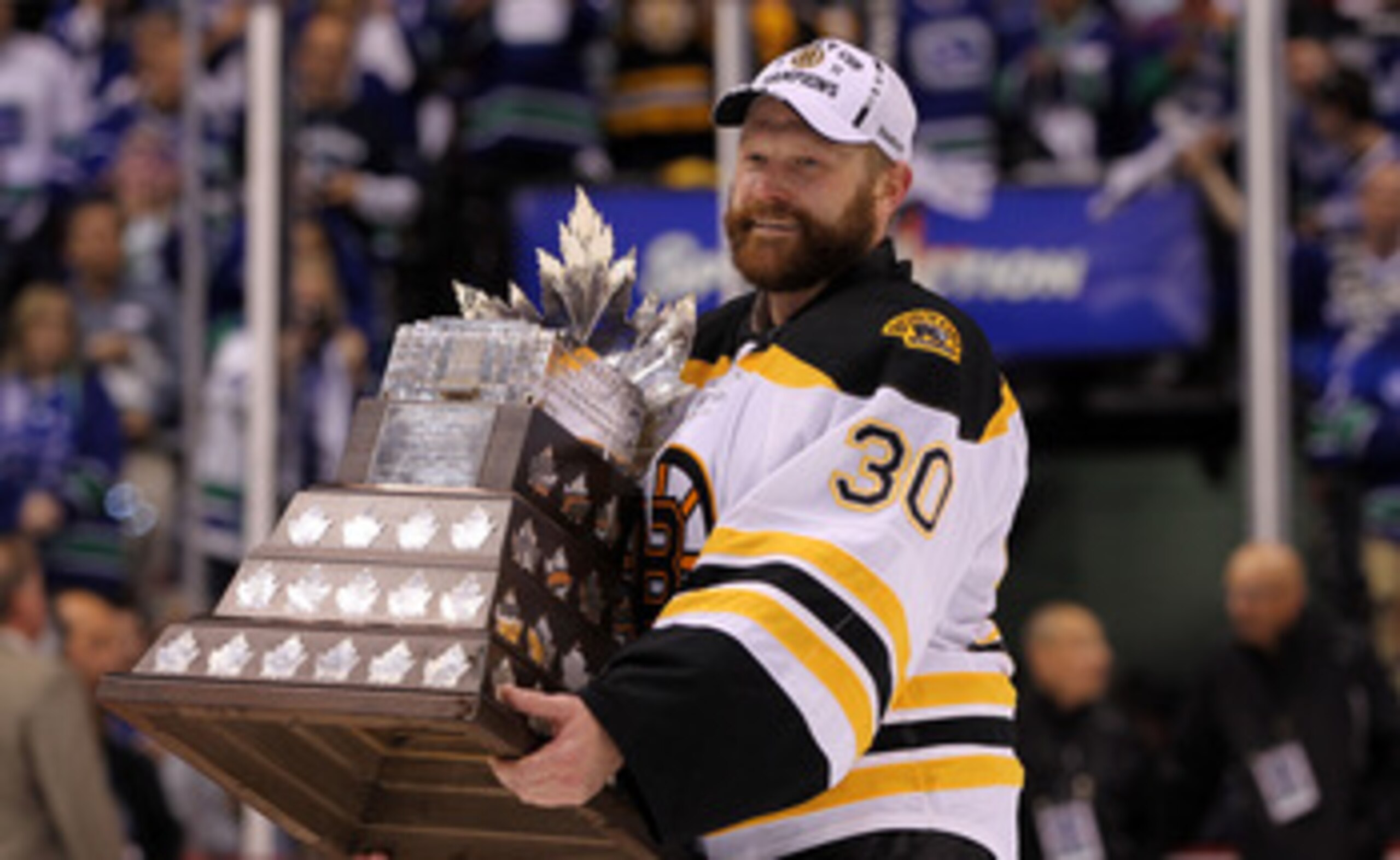 VANCOUVER, BC - JUNE 15:  Tim Thomas #30 of the Boston Bruins is awarded the Conn Smythe Trophy after defeating the Vancouver Canucks in Game Seven of the 2011 NHL Stanley Cup Final at Rogers Arena on June 15, 2011 in Vancouver, British Columbia, Canada.