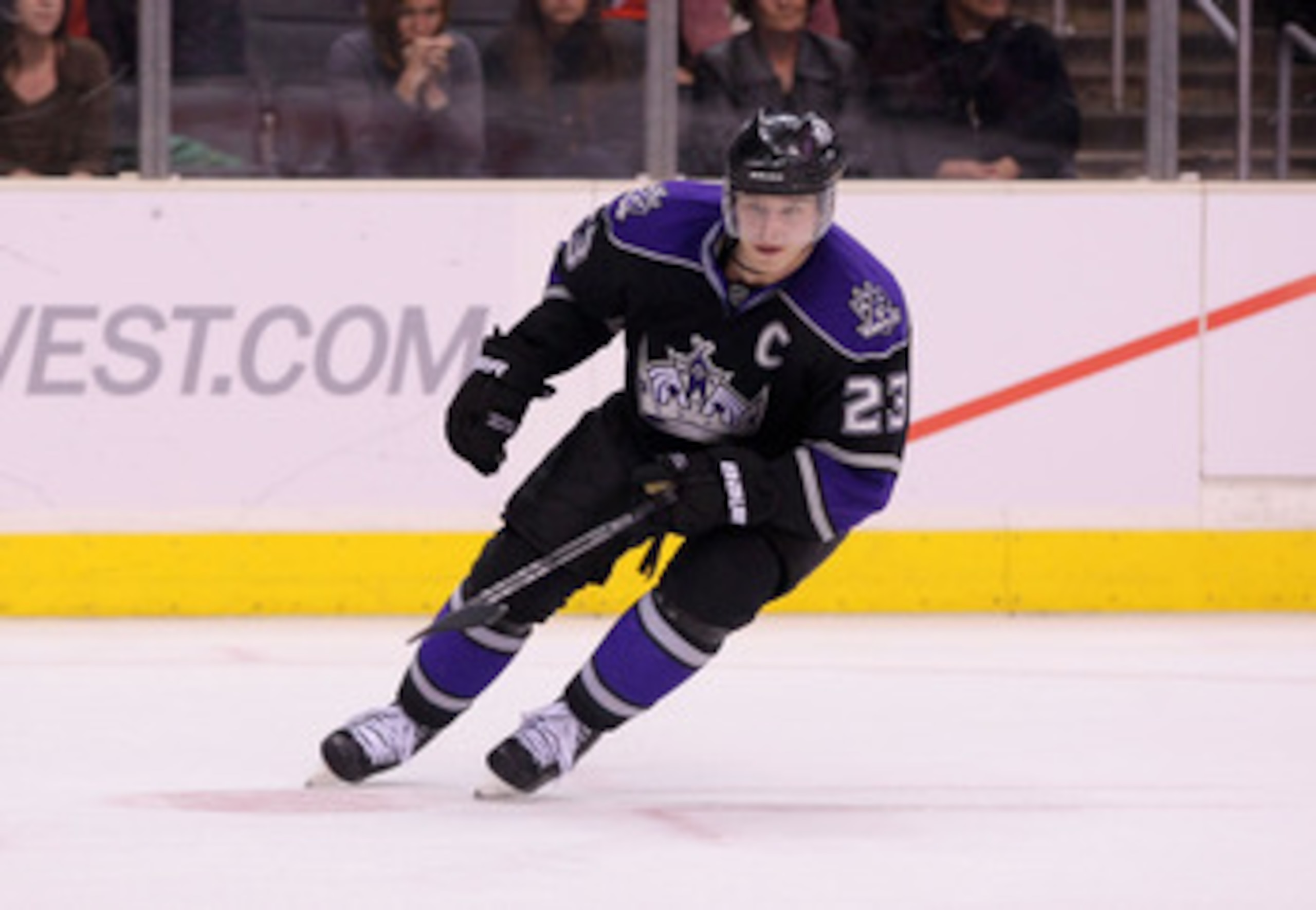 LOS ANGELES, CA - MARCH 21:  Dustin Brown #23 of the Los Angeles Kings pursues puck during their NHL game against the Calgary Flames at Staples Center on March 21, 2011 in Los Angeles, California. The Kings defeated the Flames 2-1 in shootout overtime.  (