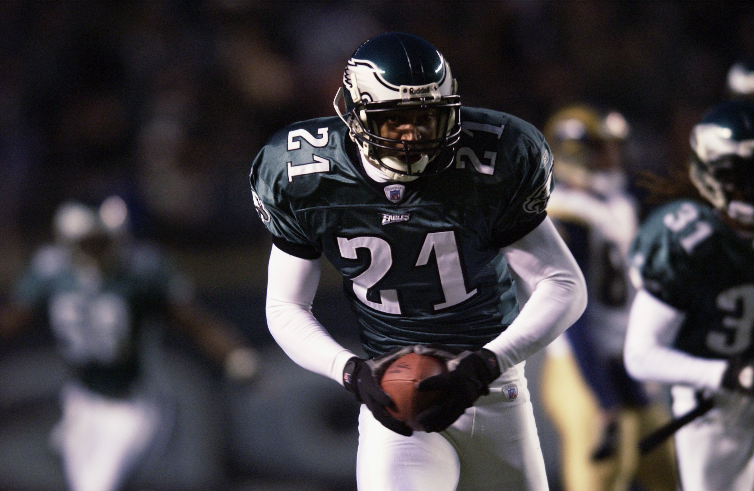 PHILADELPHIA - DECEMBER 1:  Cornerback Bobby Taylor #21 of the Philadelphia Eagles runs an interception back 23 yards for a touchdown against the St. Louis Rams in the first quarter of the NFL game on December 1, 2002 at Veterans Stadium in Philadelphia, 
